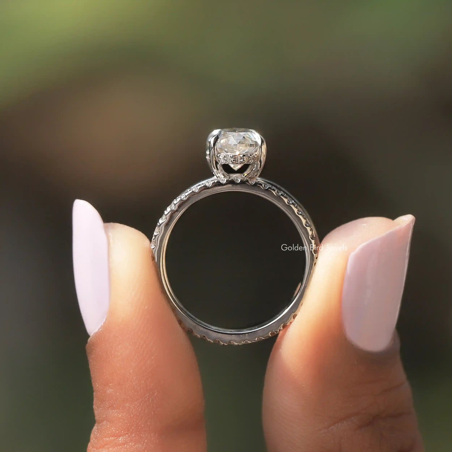 Back View of Marquise Cut Moissanite Halo Bridal Wedding Ring In two fingers