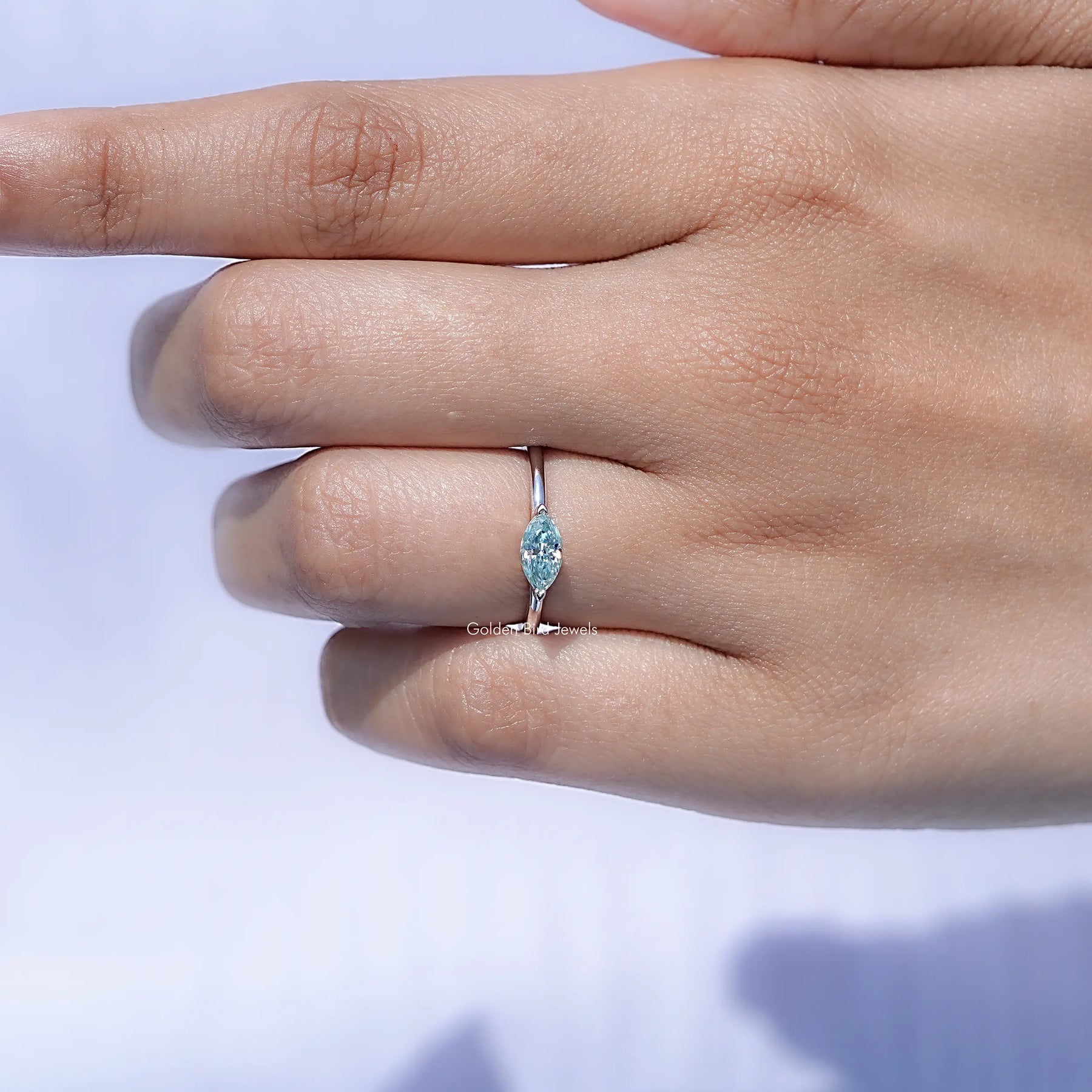 View of Moissanite Marquise Solitaire Ring in prongs setting