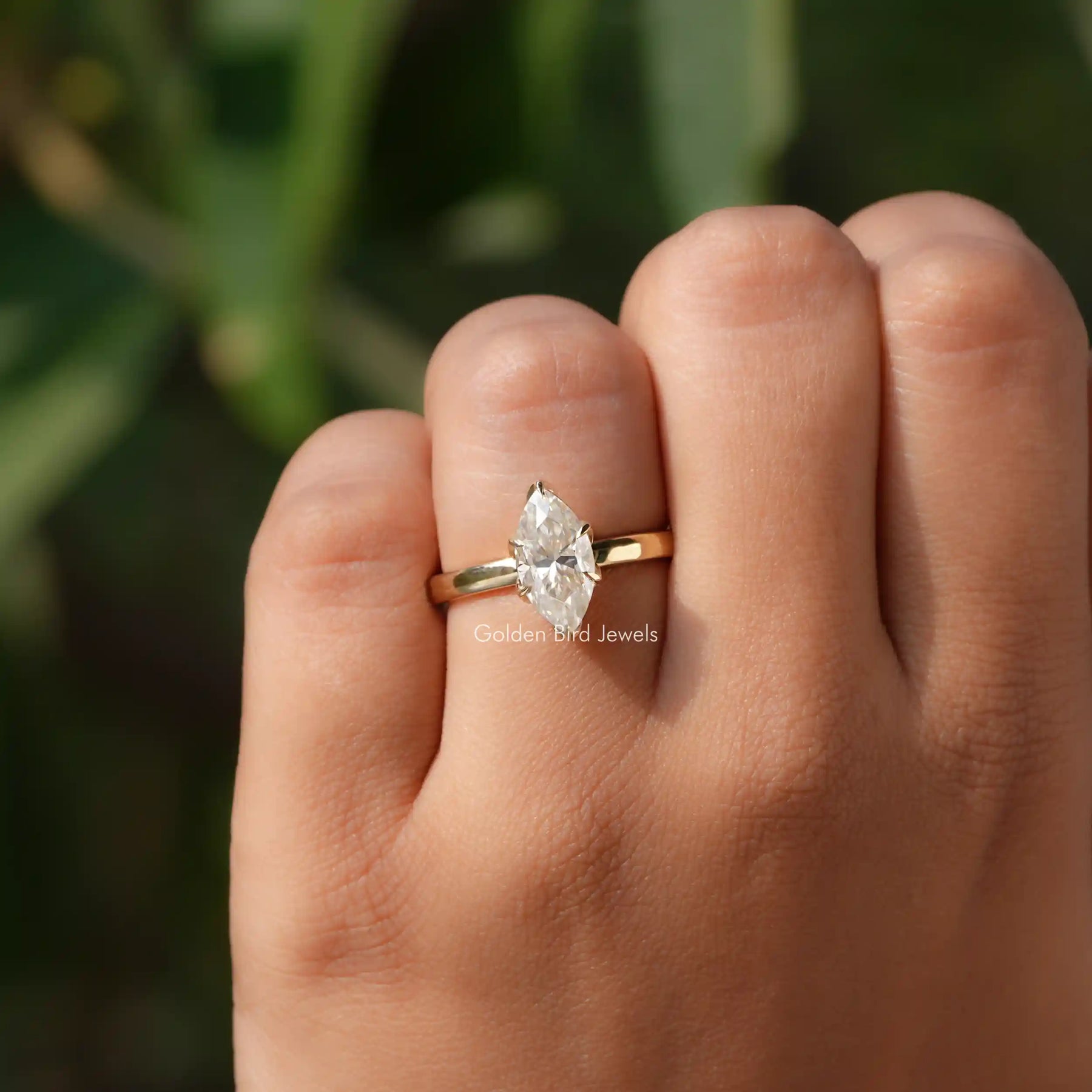 View of Marquise Cut Solitaire Moissanite Engagement Ring in
Yellow Gold