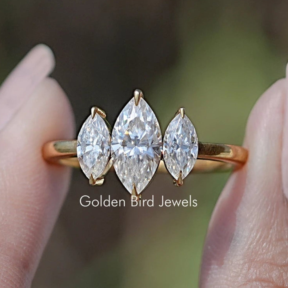 Front view of Marquise Moissanite Three Stone Engagement Ring