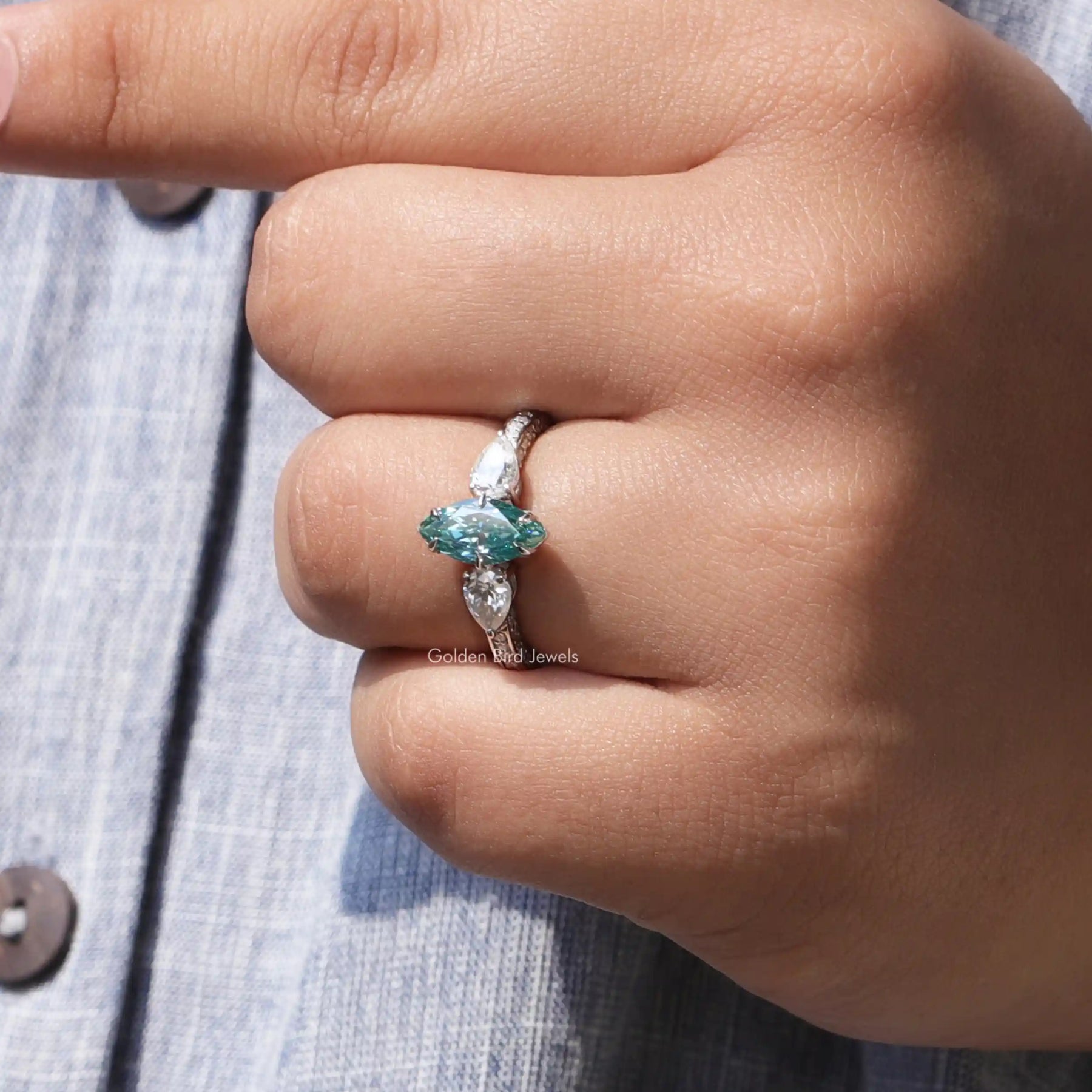 View of Marquise And Pear Cut Moissanite Three Stone Ring In White Gold