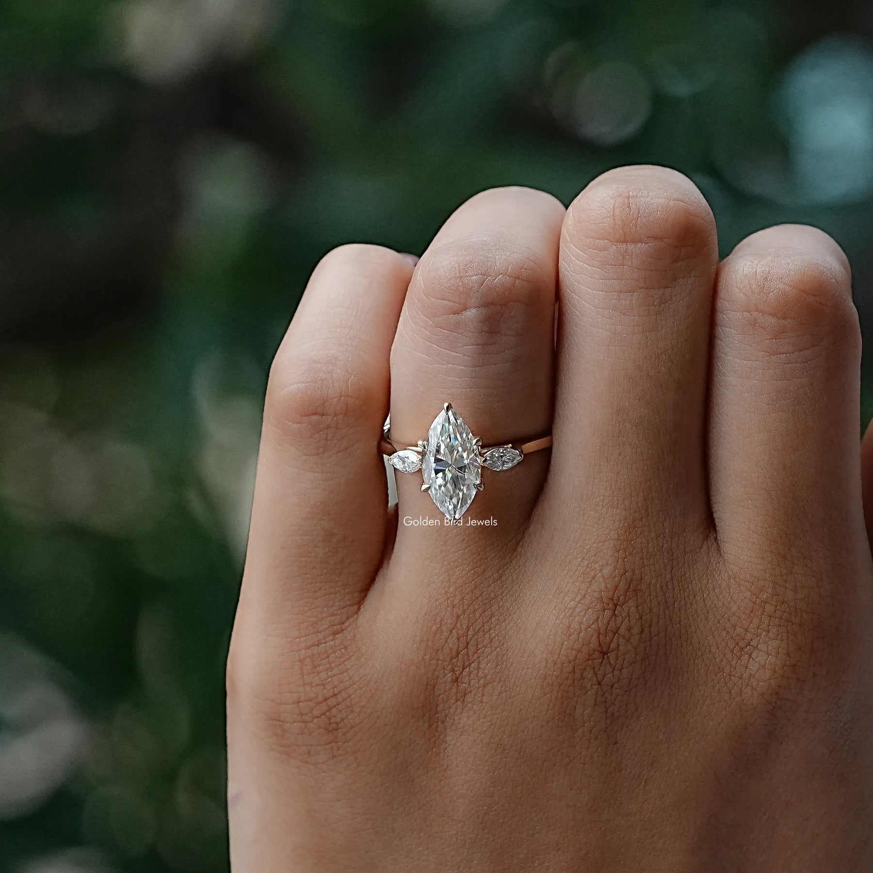 View of Marquise Cut Moissanit Three Stone Ring In Yellow Gold