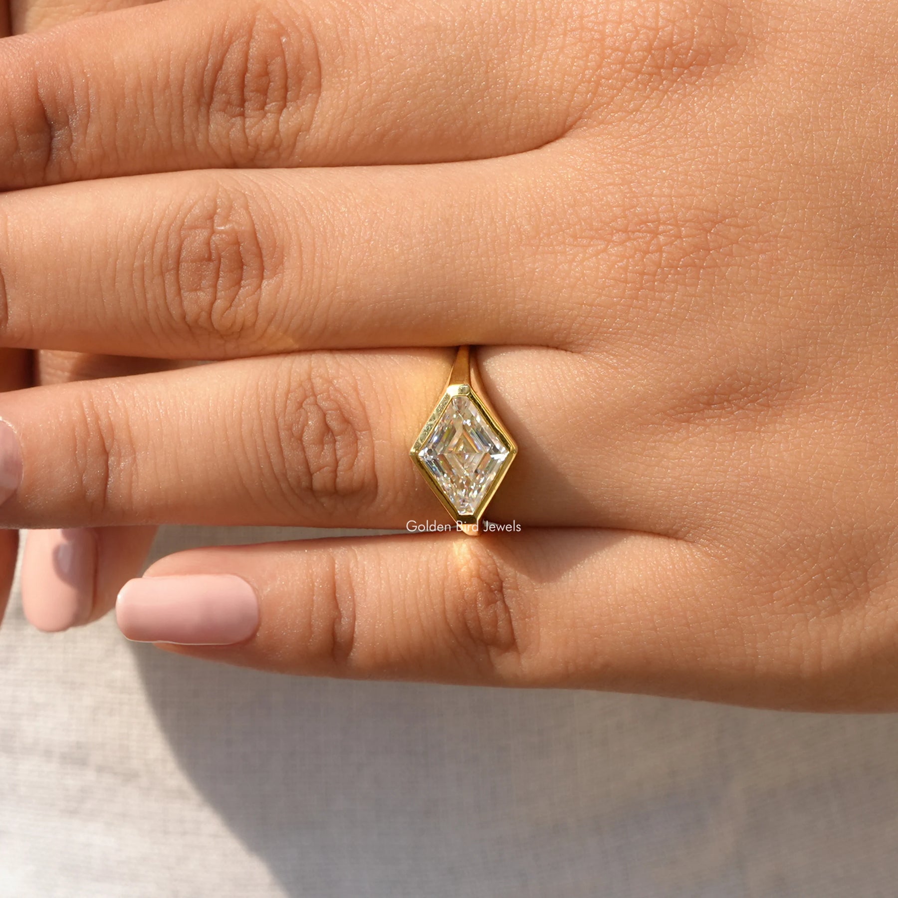 Moissanite Modified Lozenge Cut Bezel Set Ring In Yellow Gold