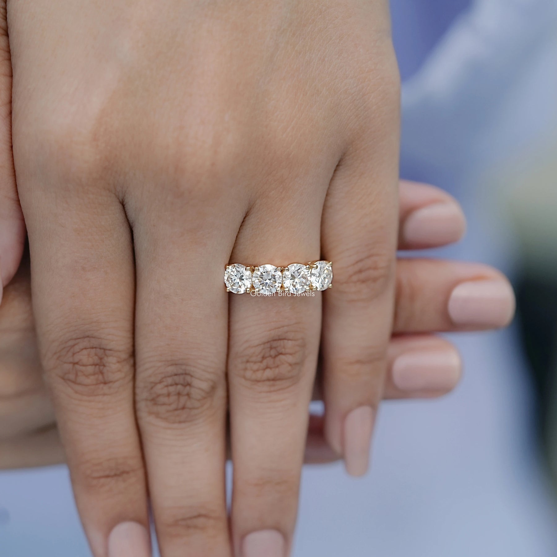 In finger front view of Moissanite Round Cut Eternity Wedding Band