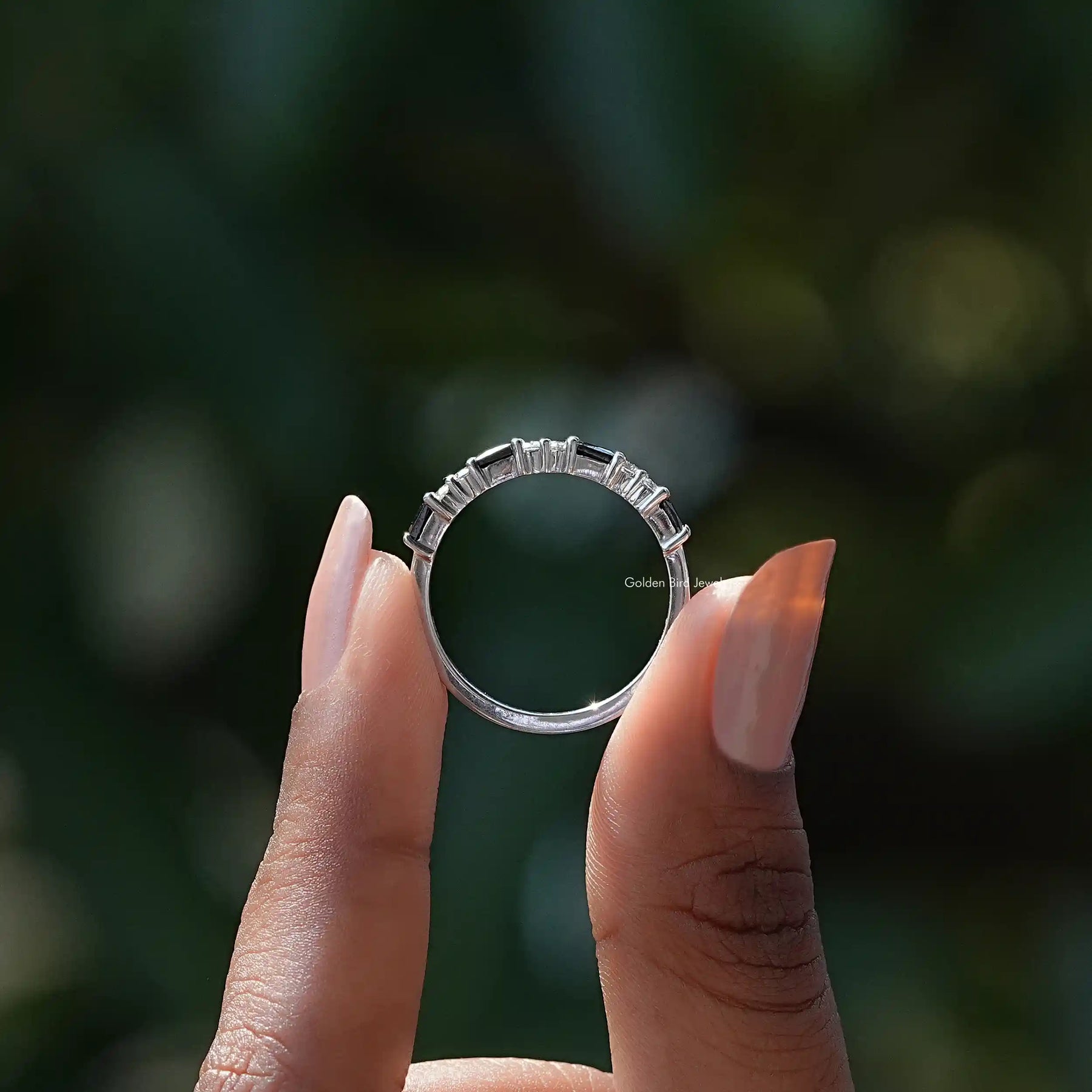 Back View of Colorless Moissanite Baguette Half Eternity Band In two fingers