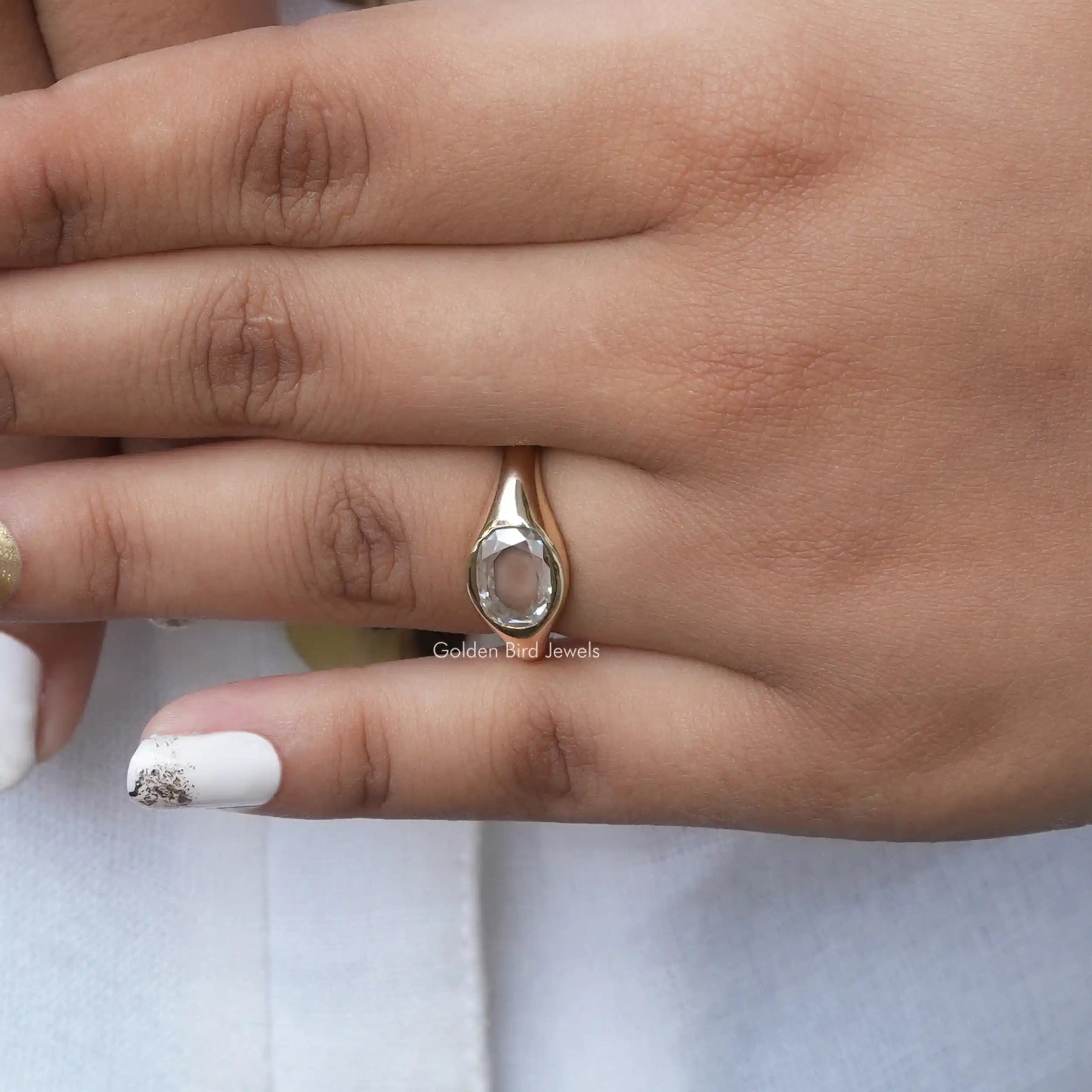 View of Oval Cut Moissanite Engagement Ring In Yellow Gold