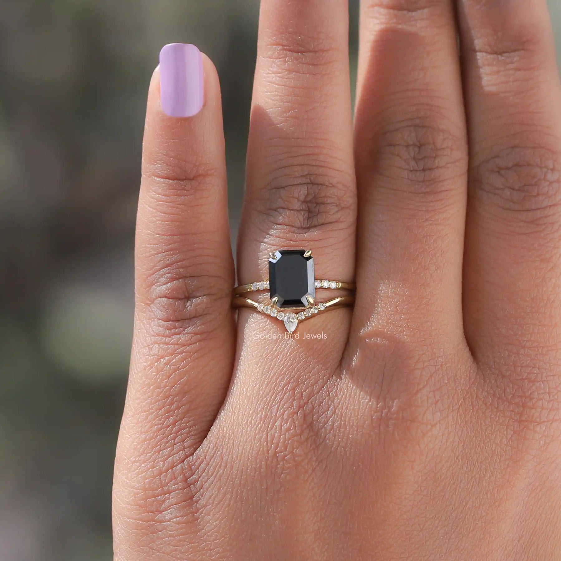 Emerald Cut Moissanite Bridal Ring Set In finger