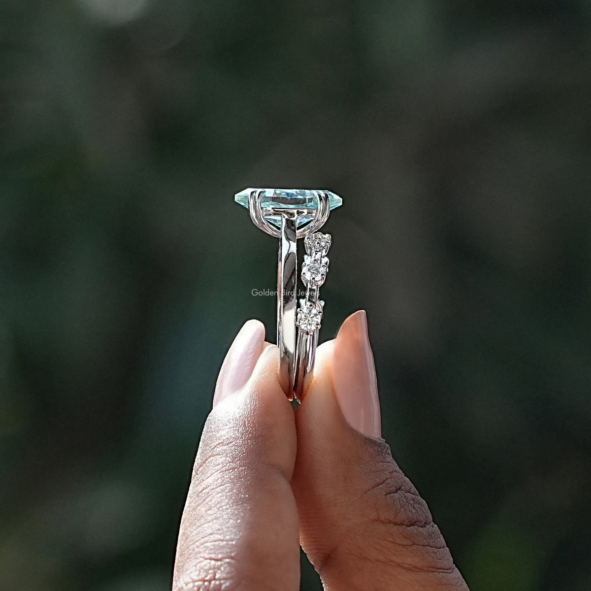 Side View of Dutch Marquise Cut Bridal Ring Set In two fingers