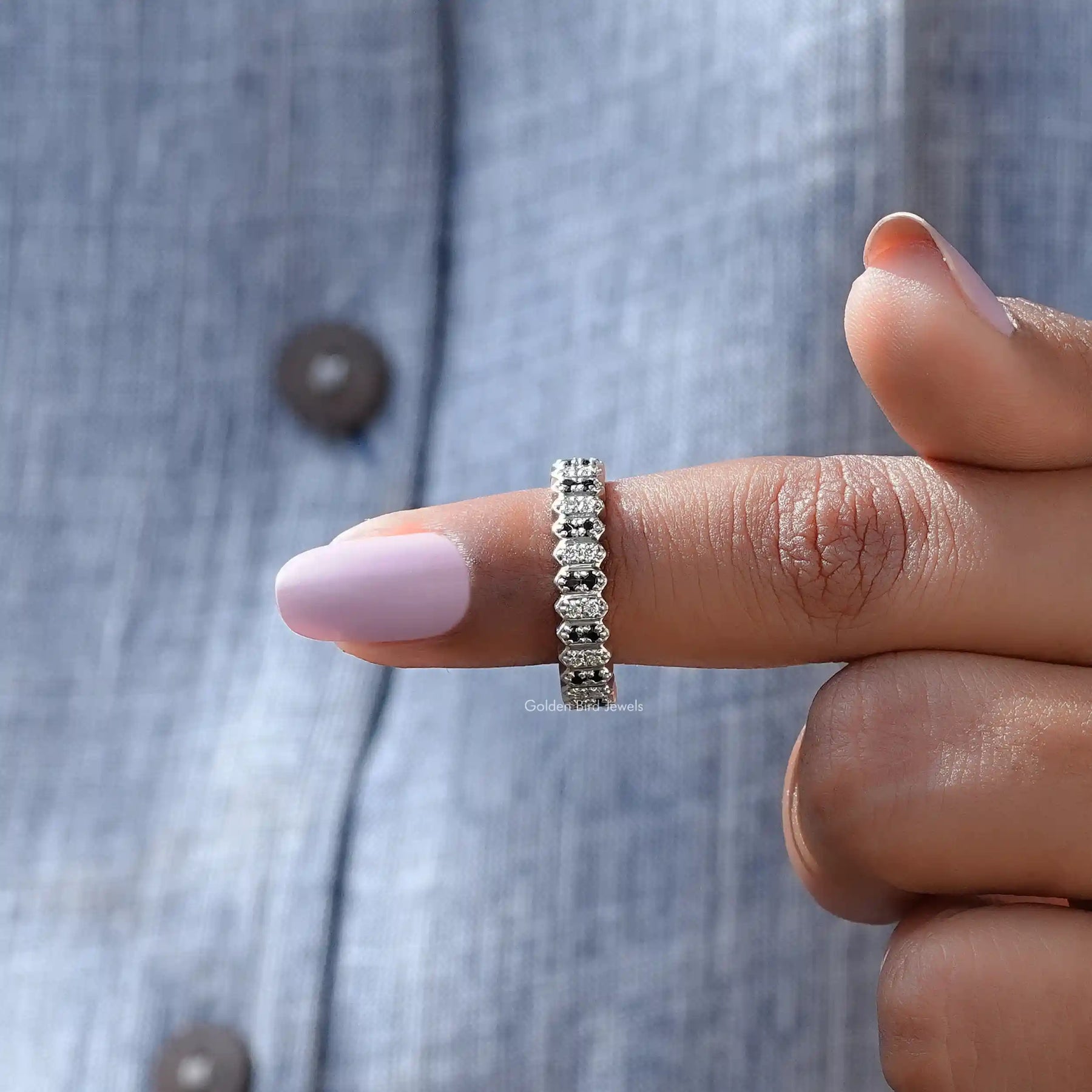 In finger front View of Round Cut Moissanite Half Eternity Wedding Band In White Gold