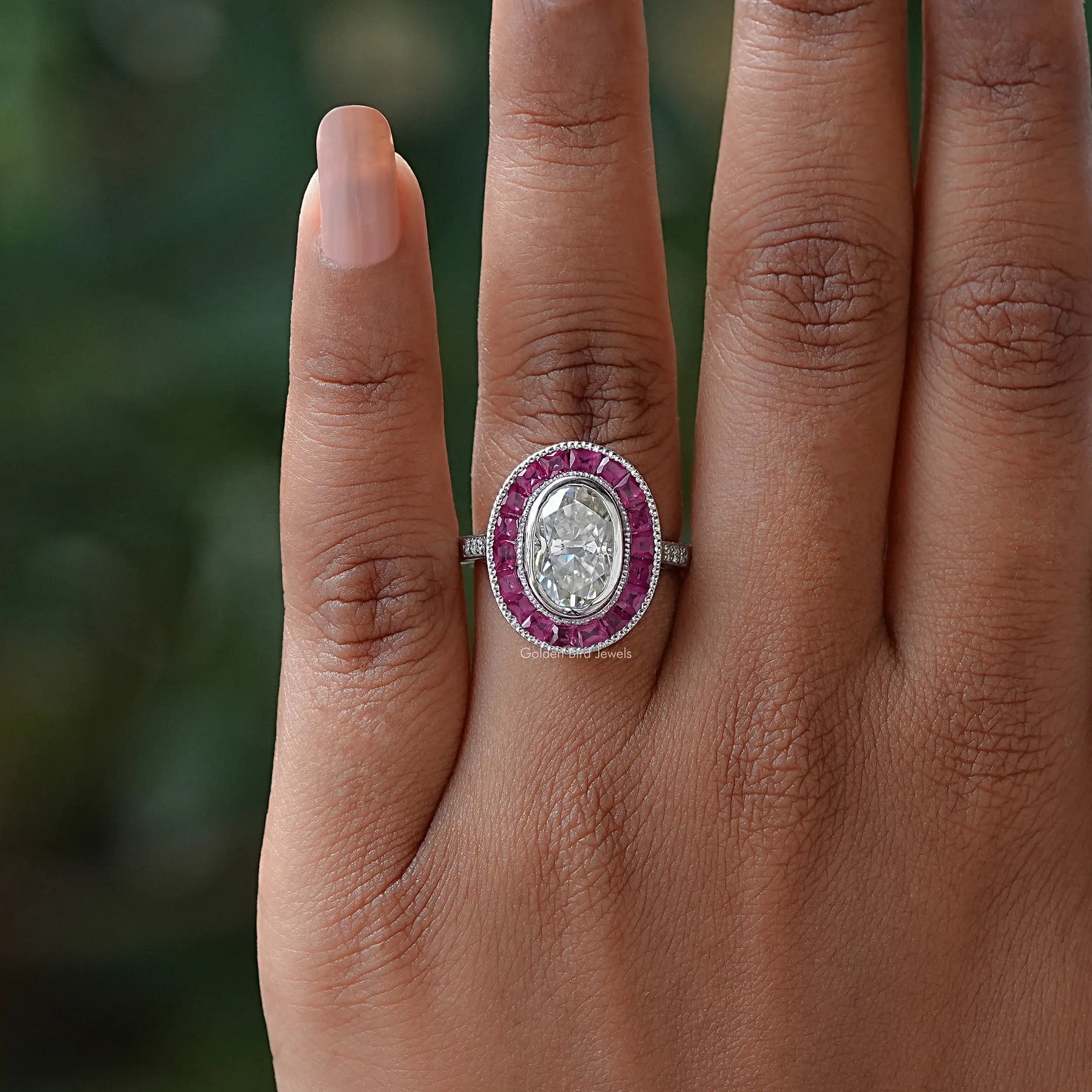 Detailed View Of Oval And Tapper Baguette Cut Engagement Ring In White Gold