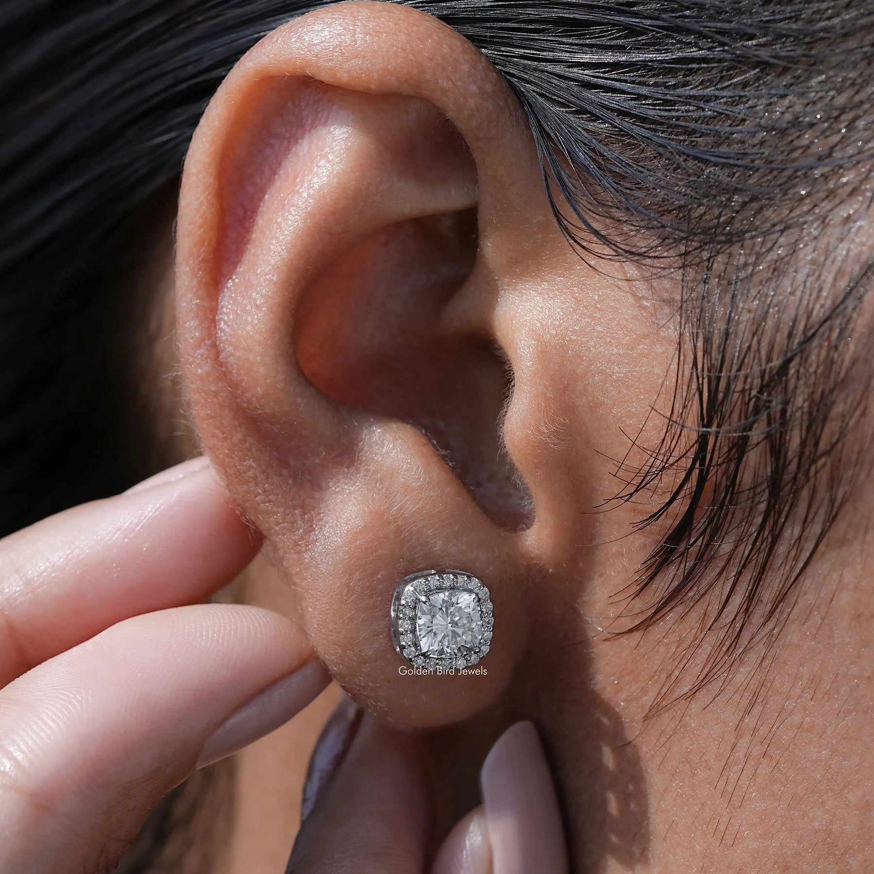 Detailed view of moissanite earrings in secure setting