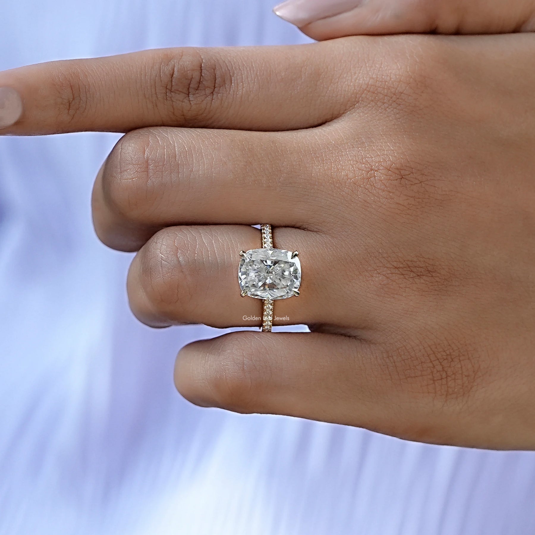 Cushion cut solitaire mossanite ring in white gold