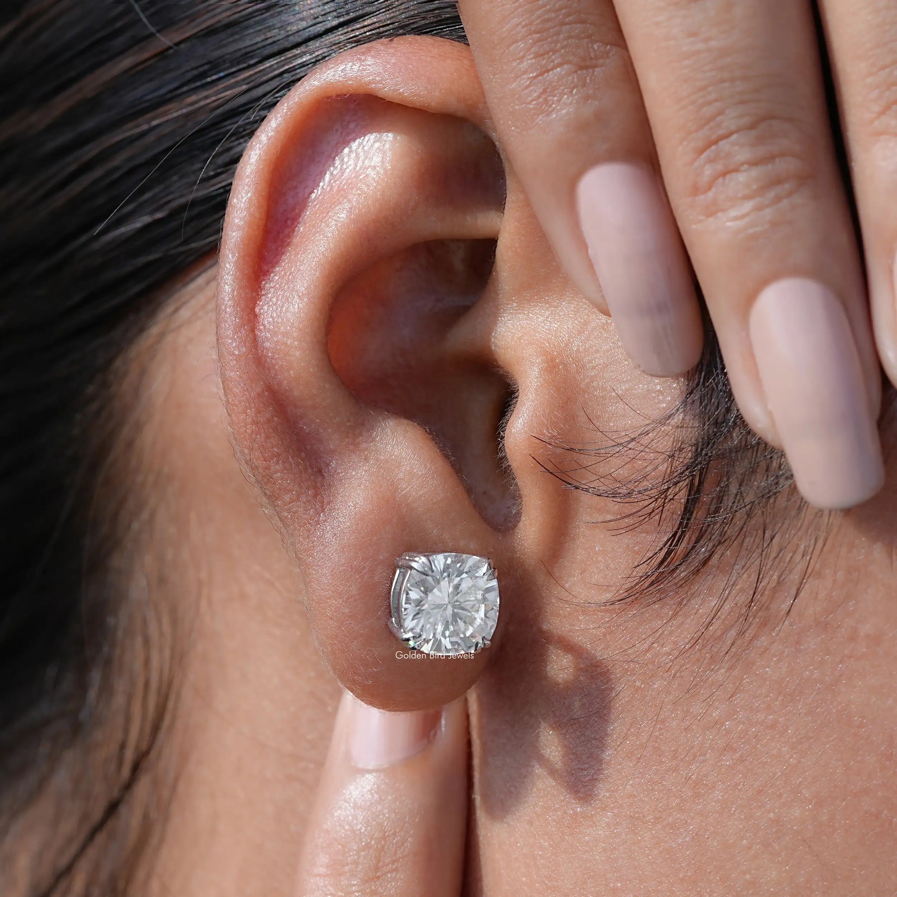 Detailed view of moissanite earrings in secure setting
