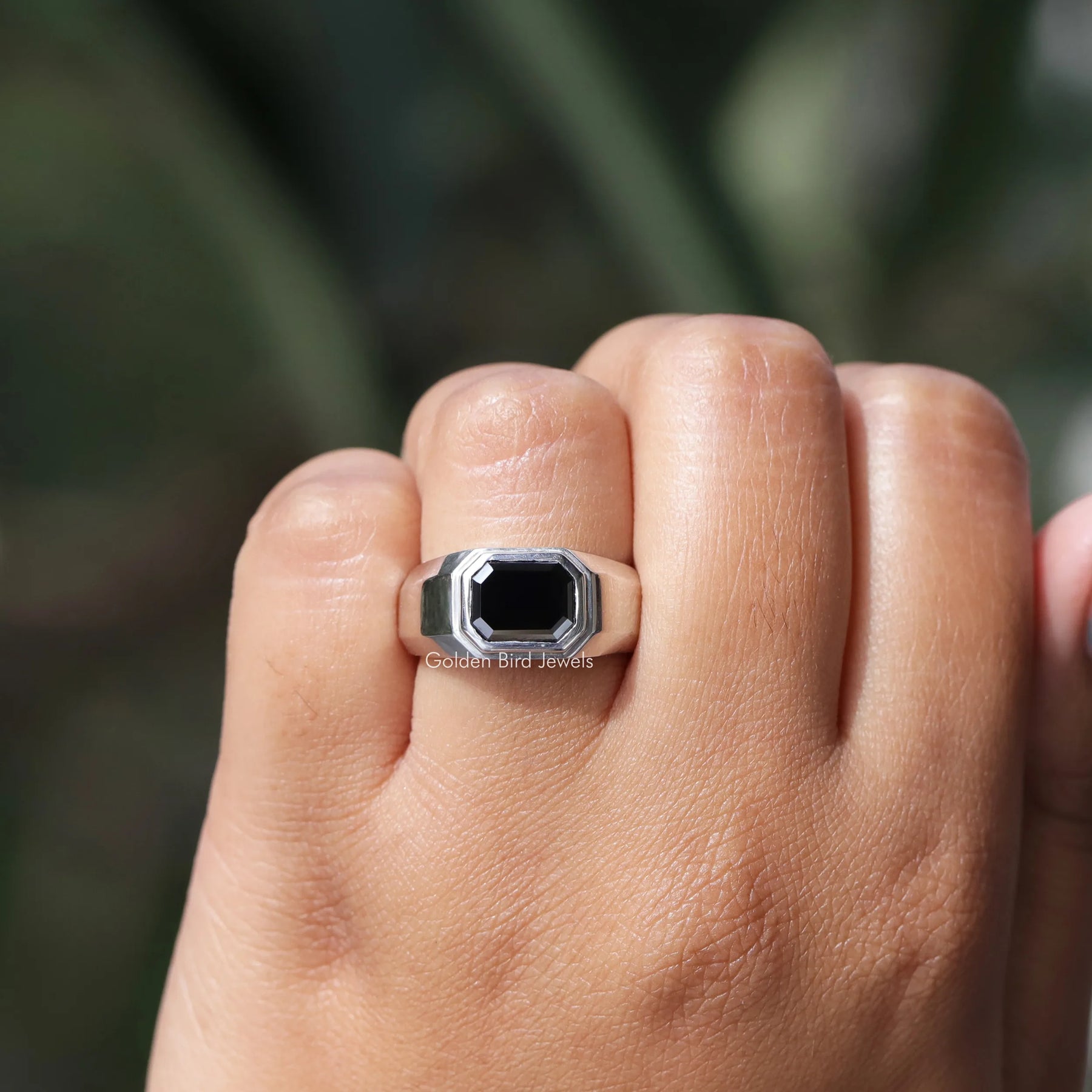 In hand showing view of moissanite Ring