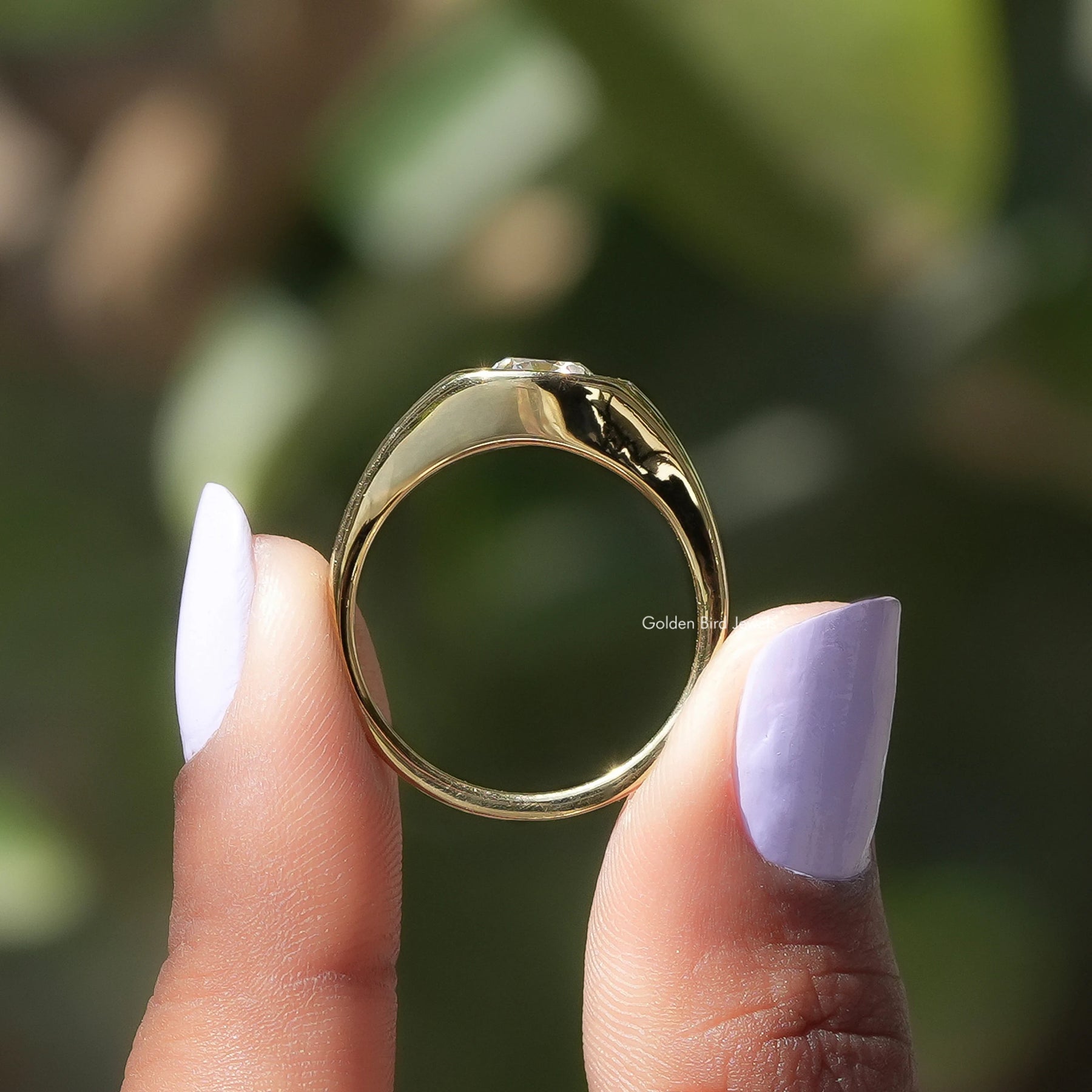 Back View of Old Mine Cushion Cut Moissanite Ring In two fingers