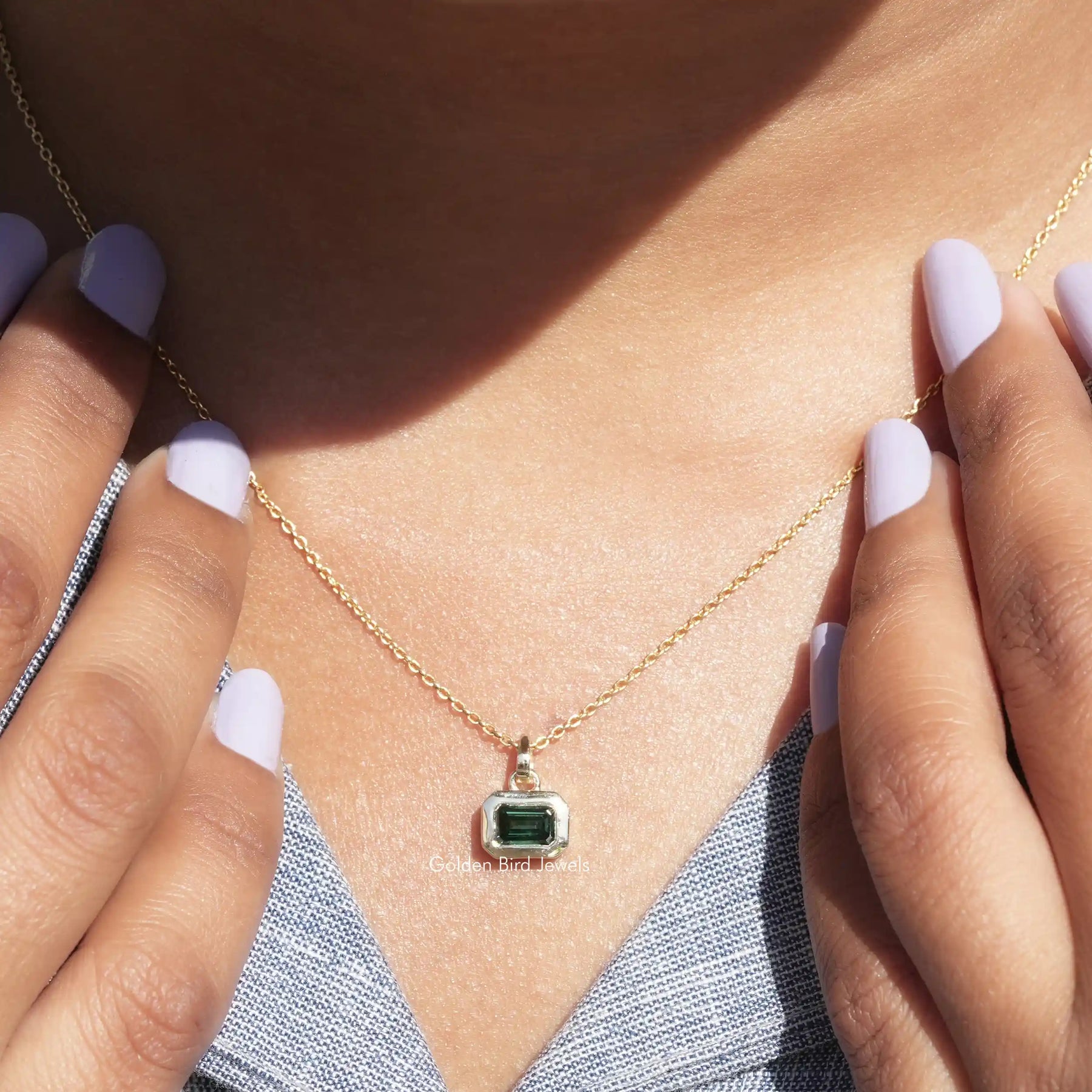Detailed view of moissanite emerald shape pendant