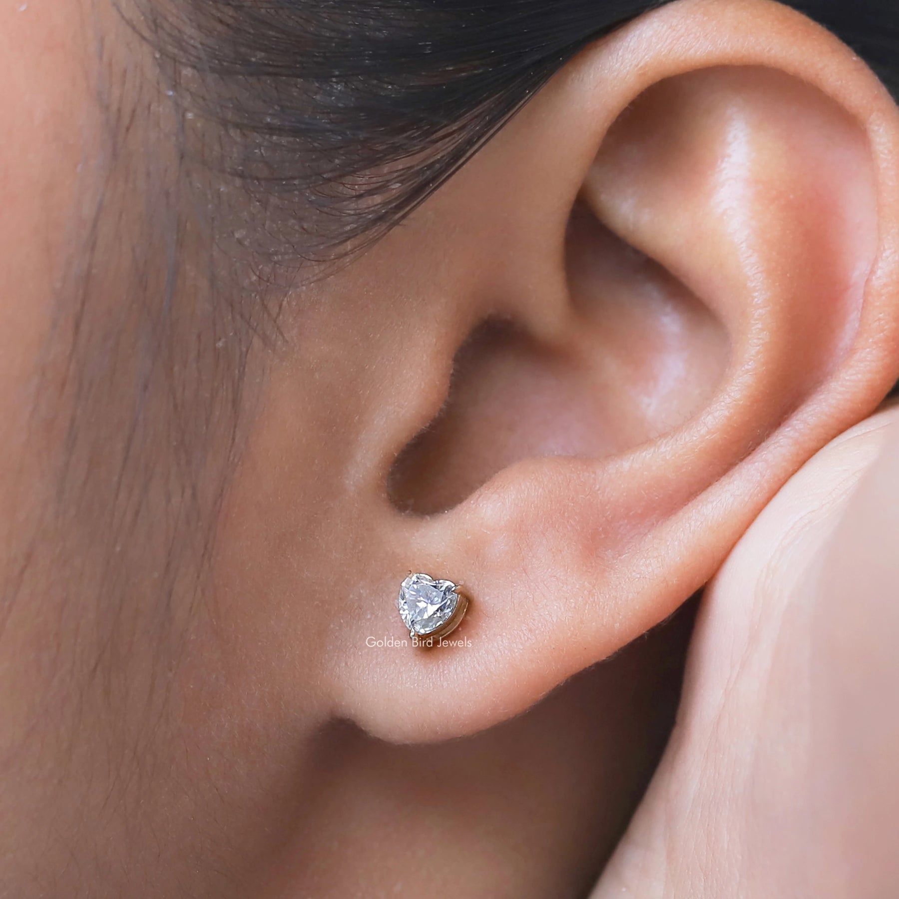 Detailed view of moissanite earrings in secure setting