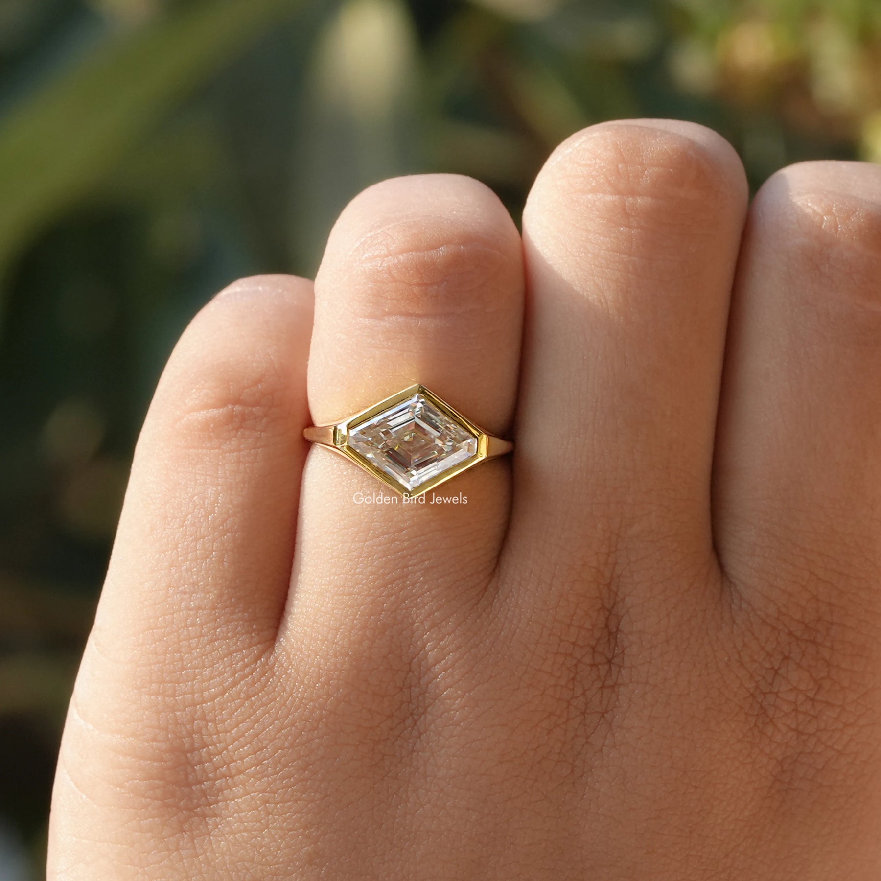 View of Moissanite Modified Lozenge Cut Ring In finger