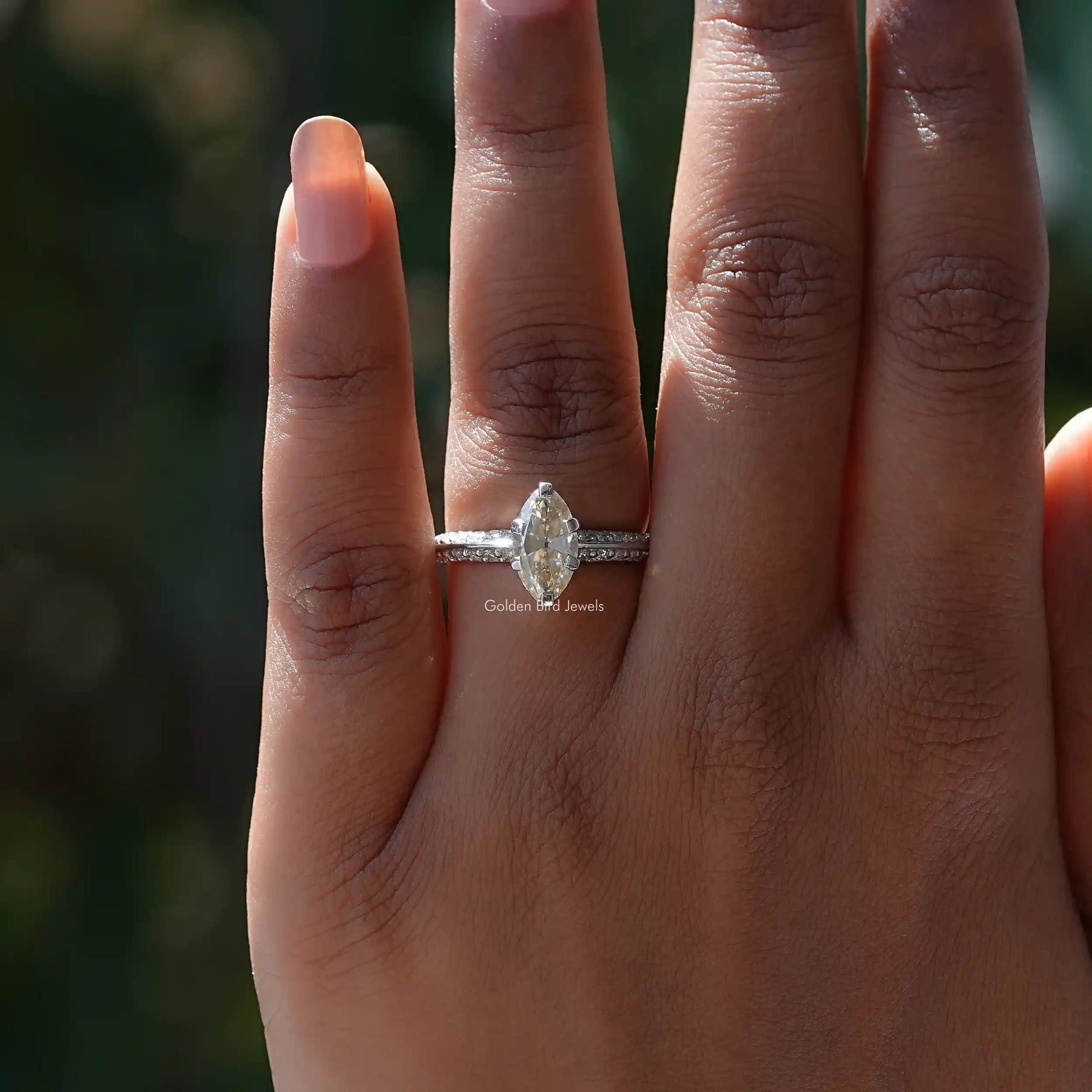 Off White Moval Cut Moissanite Accent Ring In finger