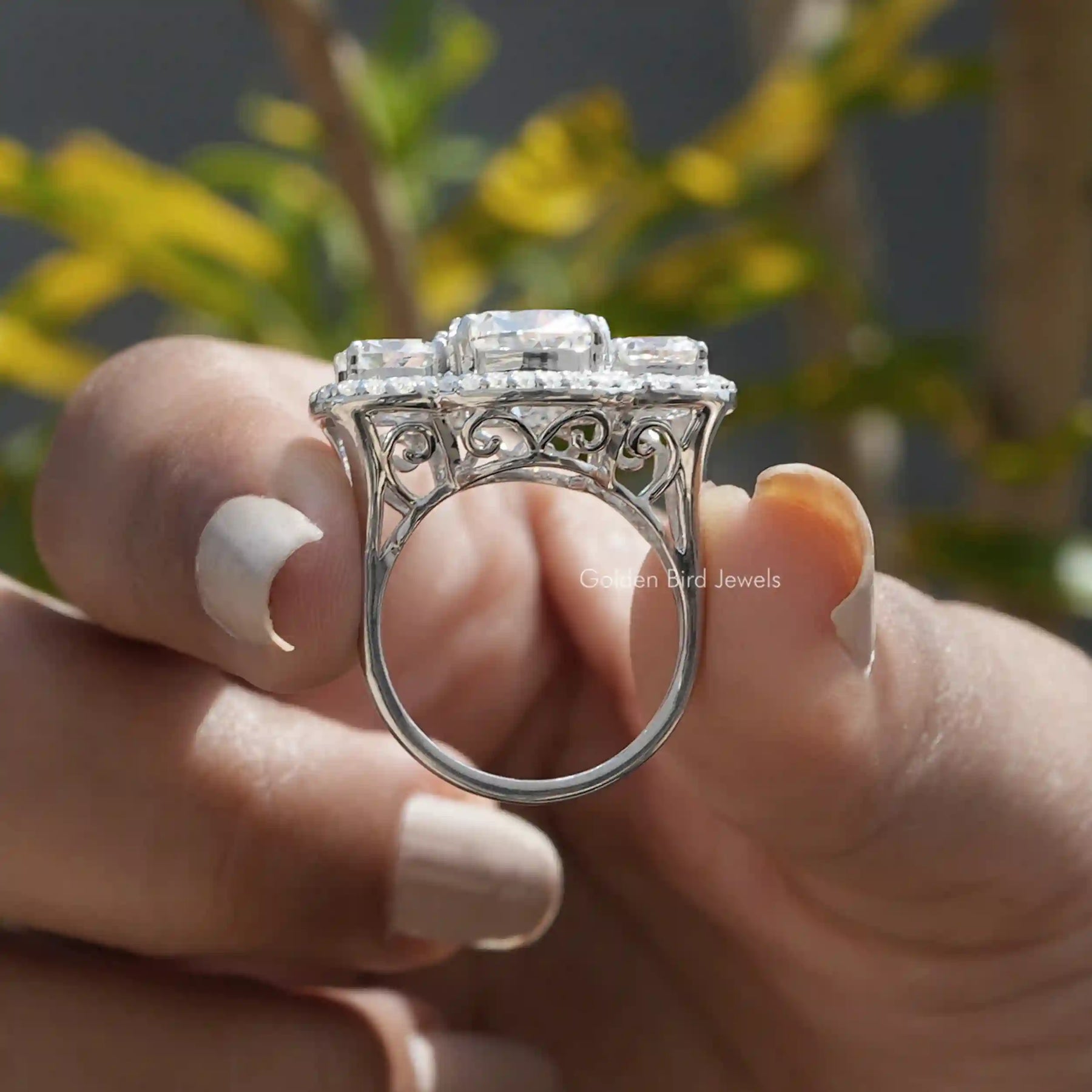 Back View of Old Mine Cushion Cut Moissanite Ring In two fingers