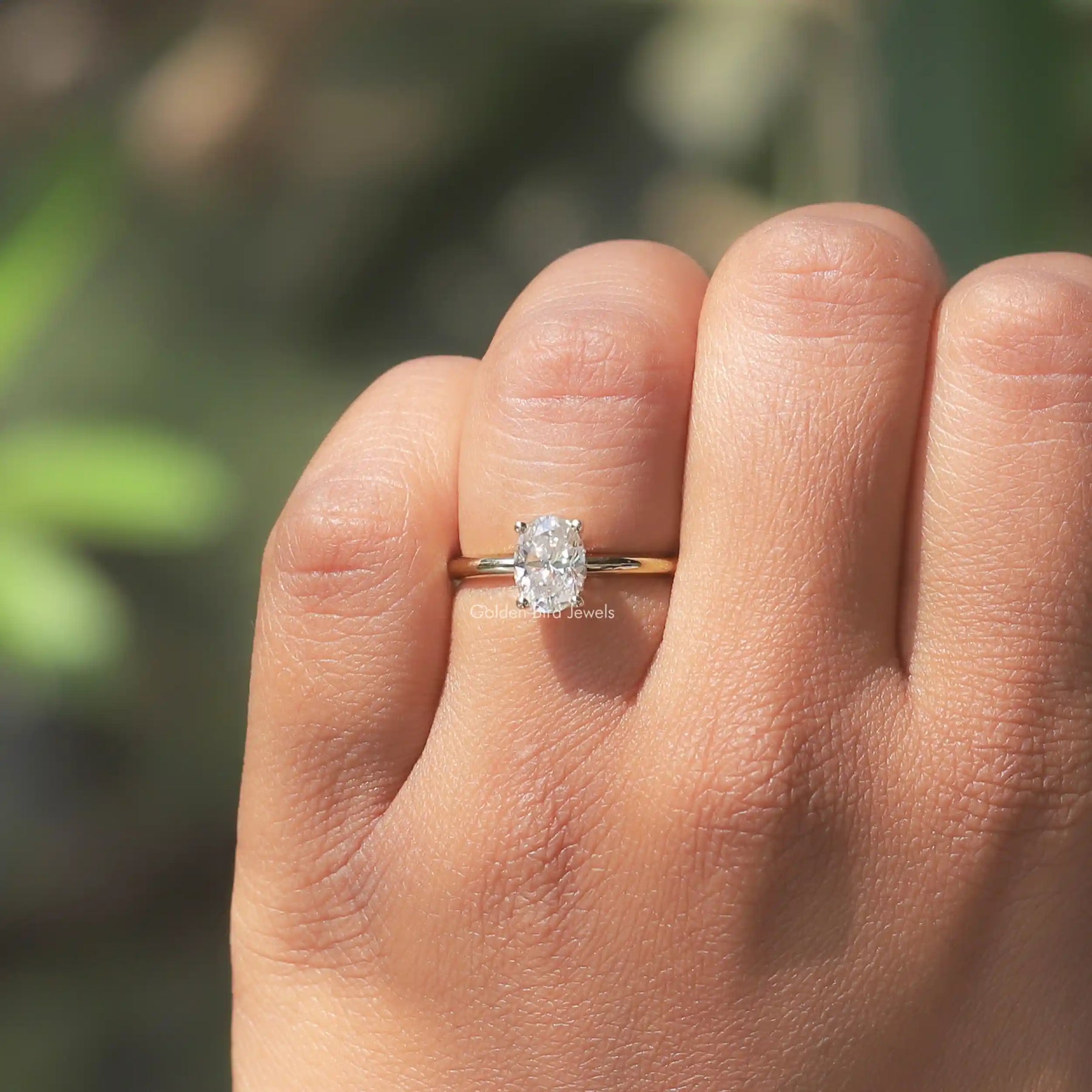 View of Oval Cut Moissanite Hidden Halo ring In finger