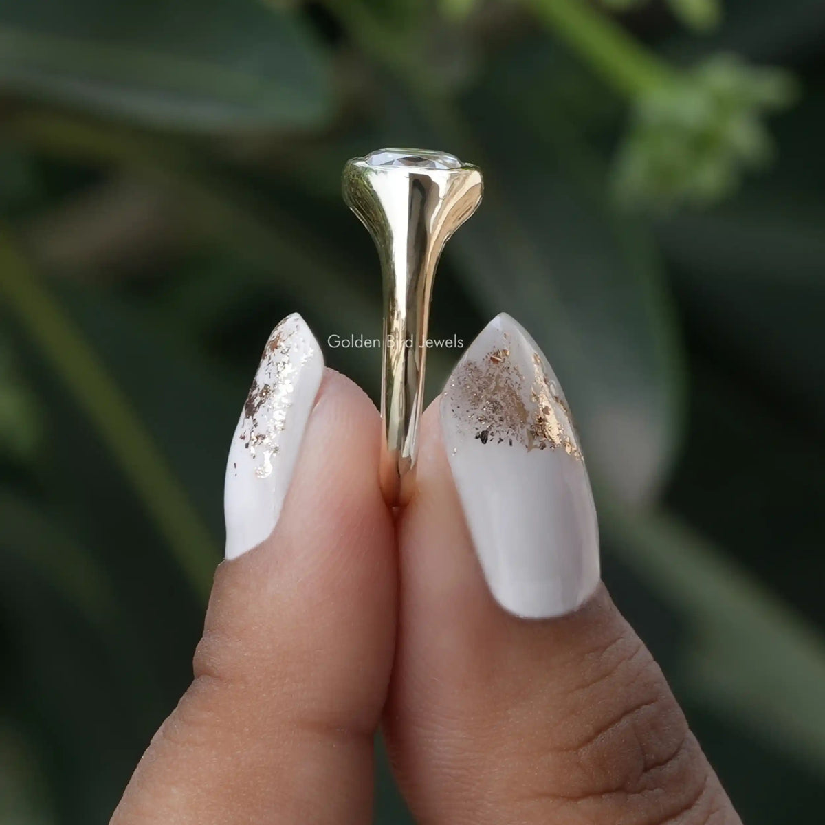 Side View of Rose Cut Oval Moissanite Engagement Ring In two fingers