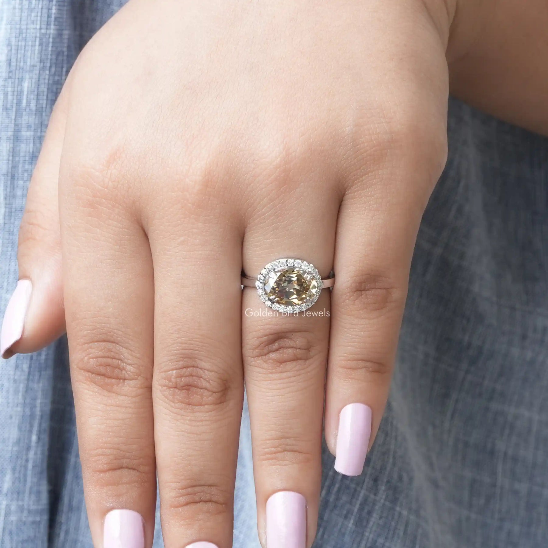 View of Moissanite Oval Cut Halo Style Engagement Ring In White Gold