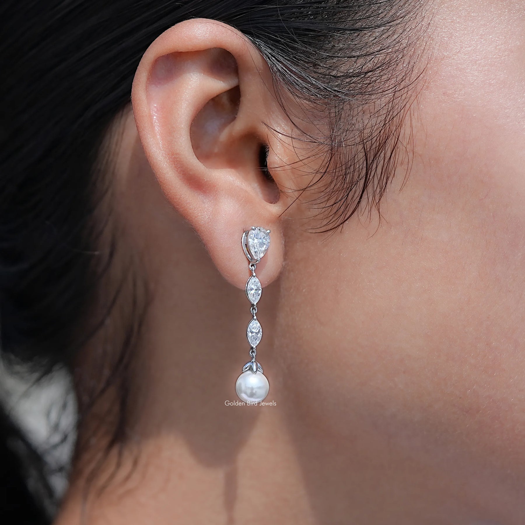 Front view of Pear And Marquise Cut Moissanite Stud Earrings