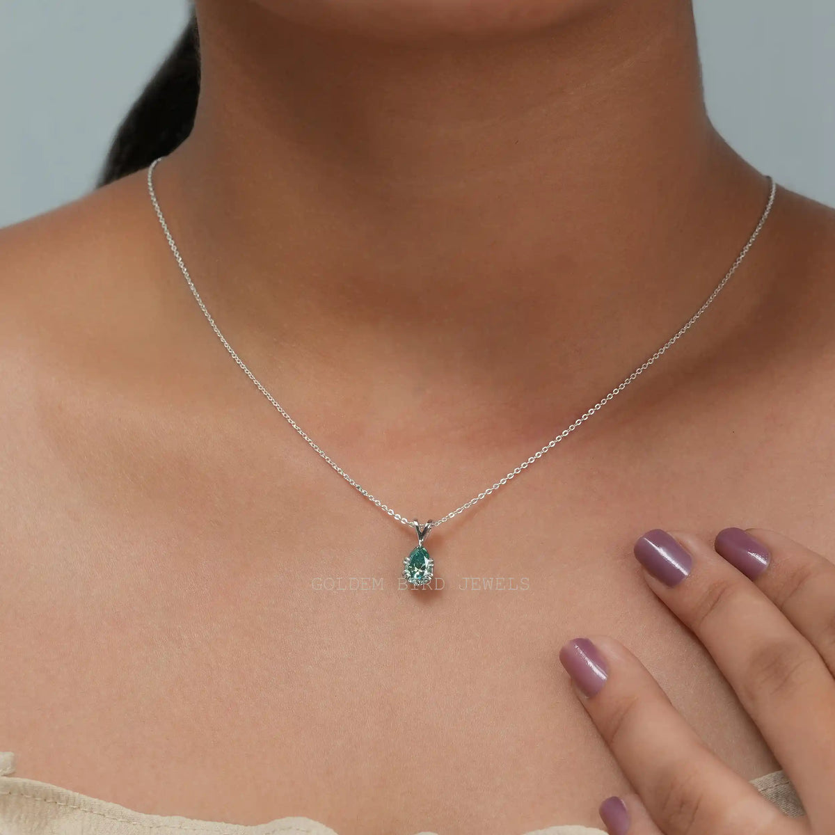 In neck front view of pear cut moissanite pendant