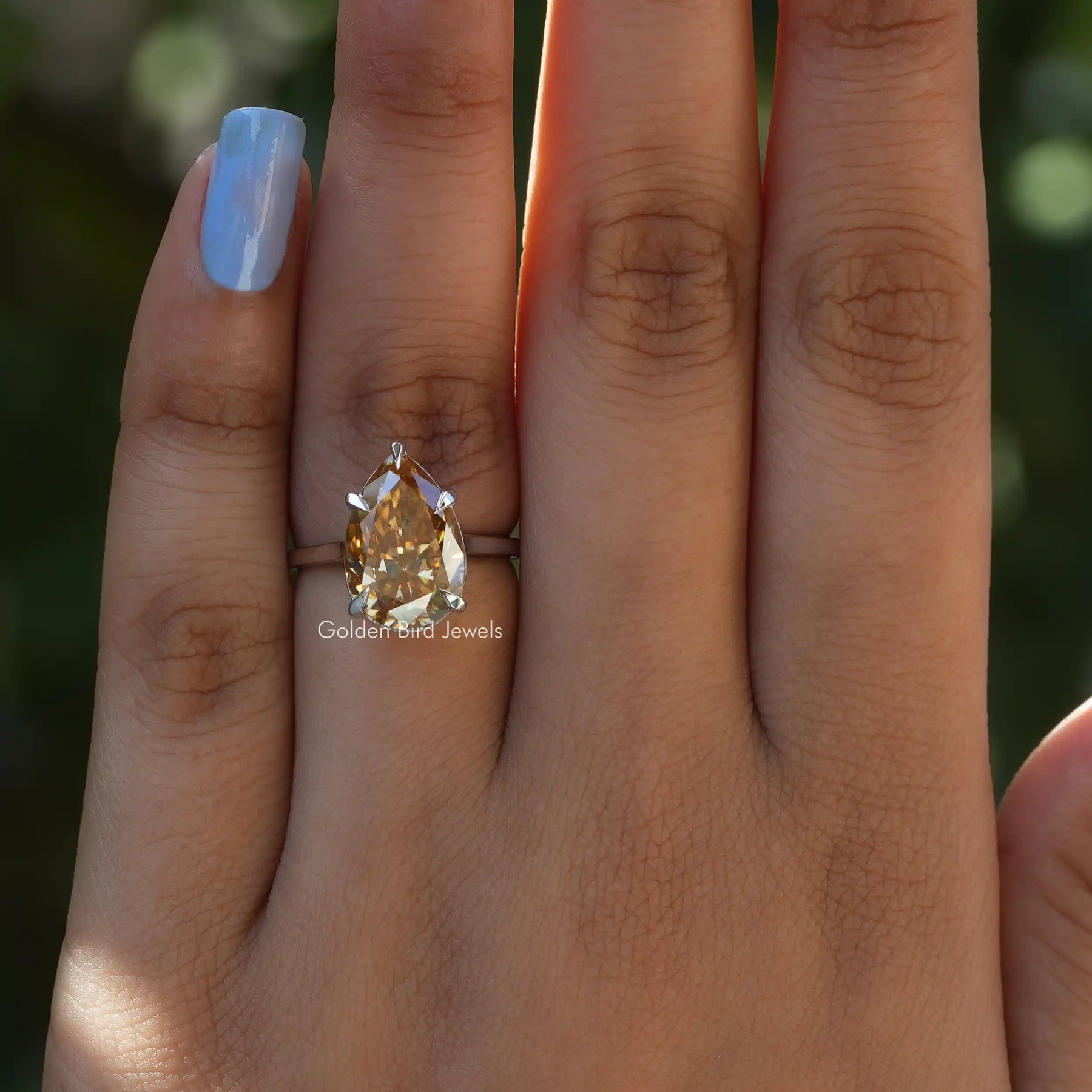 Pear Cut Moissanite Solitaire Ring In Yellow Gold
