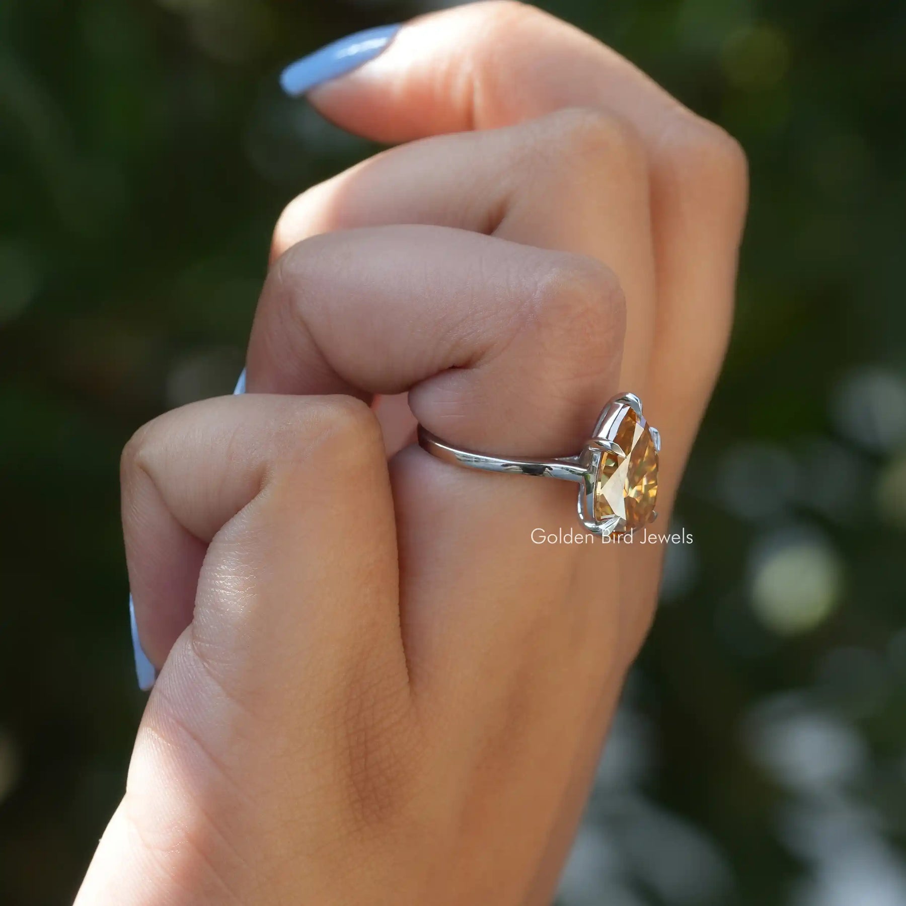 View of Moissanite Pear Cut Solitaiire Engagement Ring In Finger