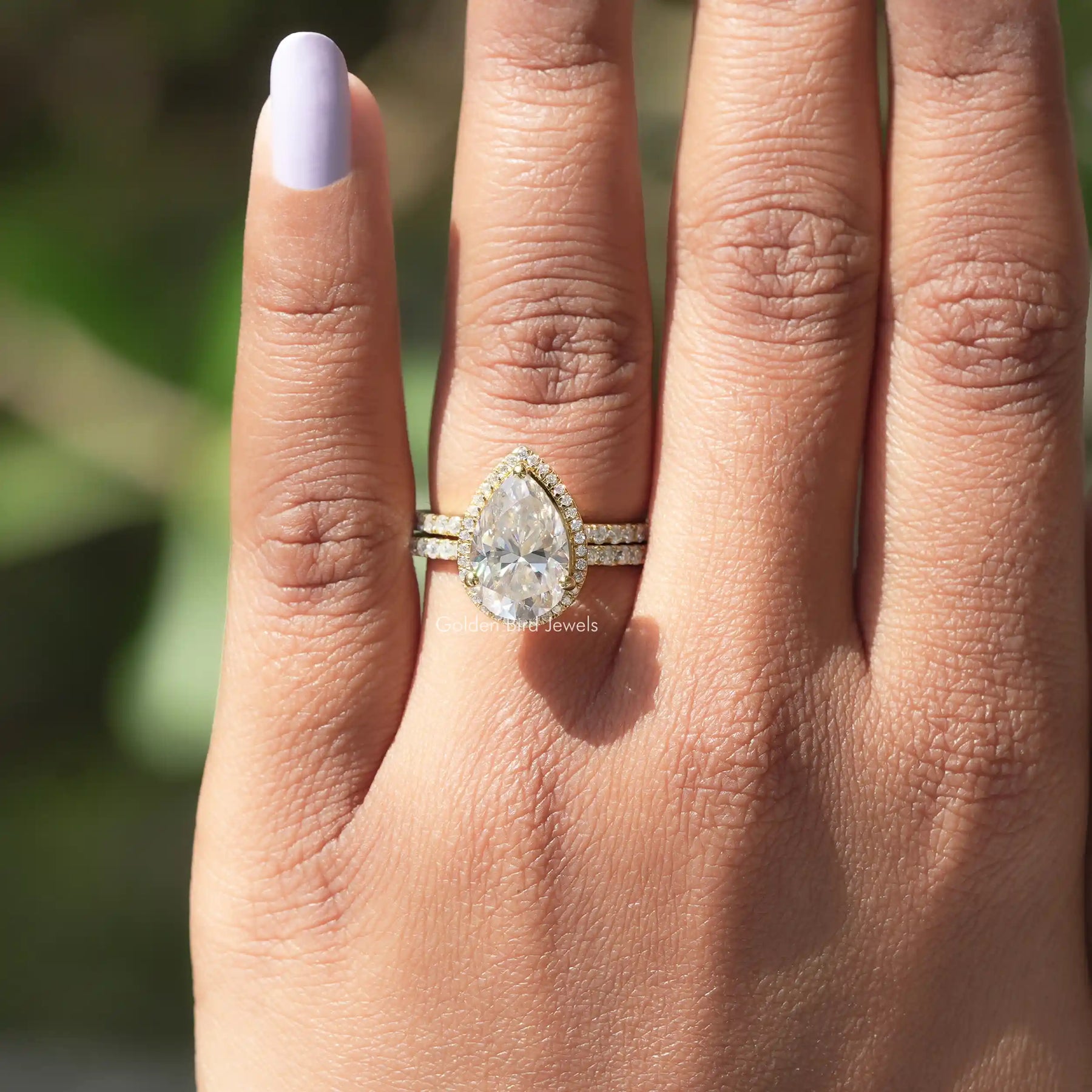View of Pear Cut Moissanite Engagement Ring In Yellow Gold