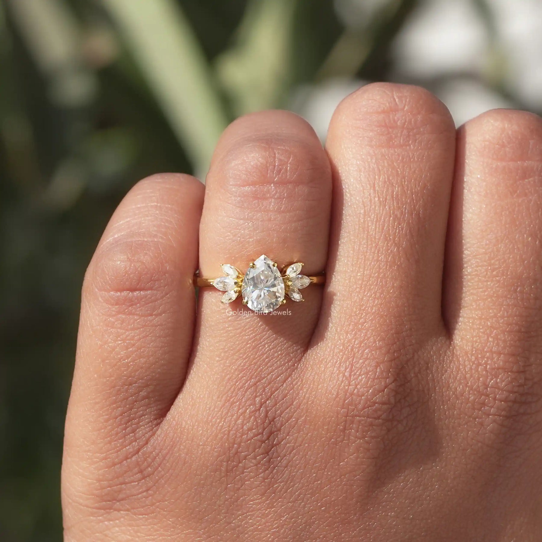 Detailed View Of Pear Cut Moissanite Ring In Yellow Gold