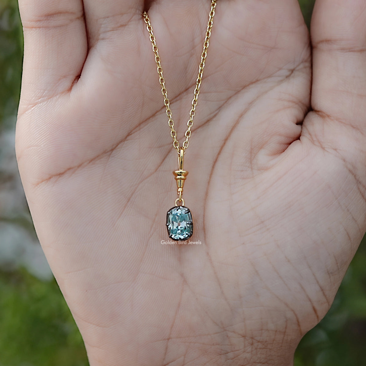 Close View Of Old Mine Cushion Moissanite Pendant in Secure Setting