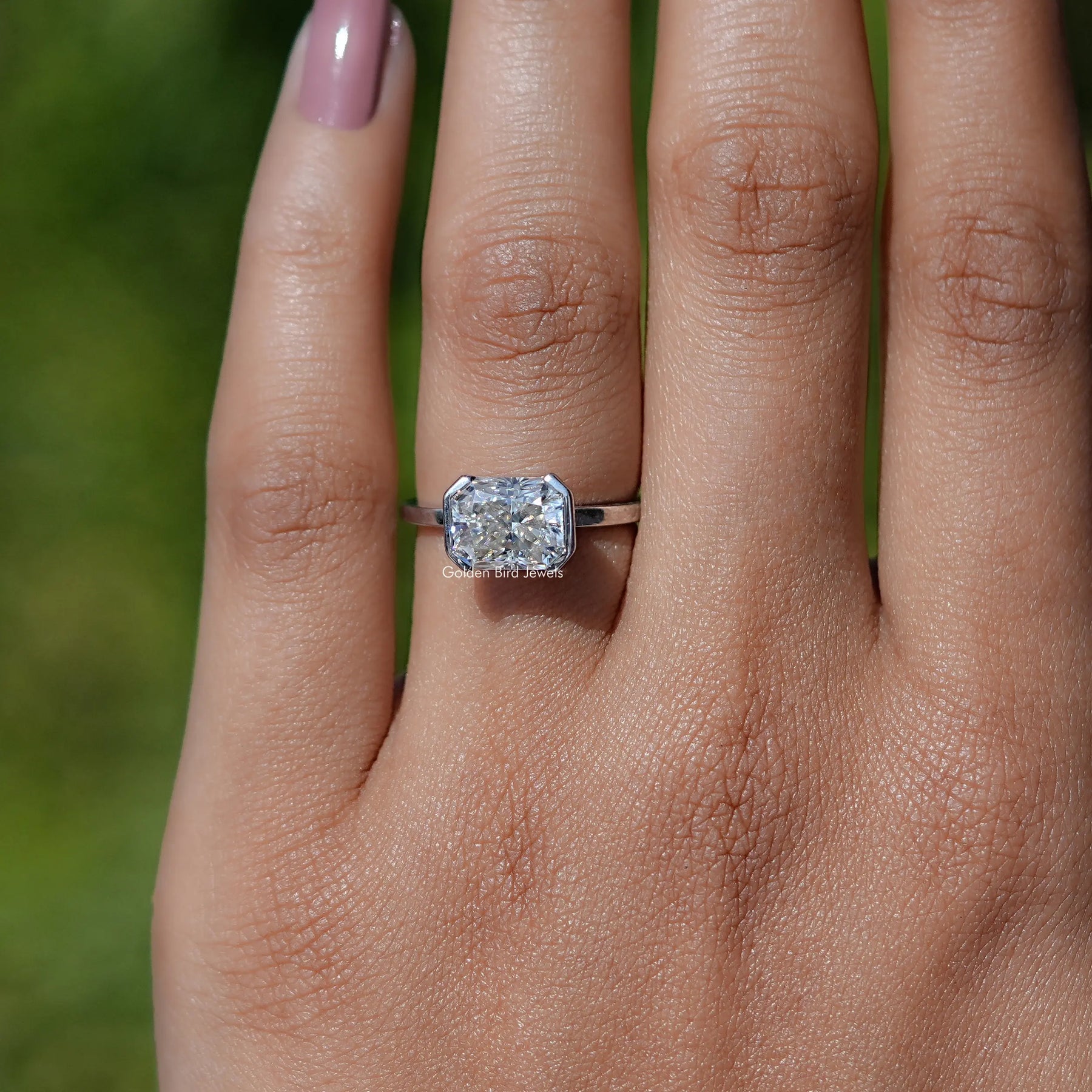 In finger view of Radiant Cut Moissanite Solitaire Ring