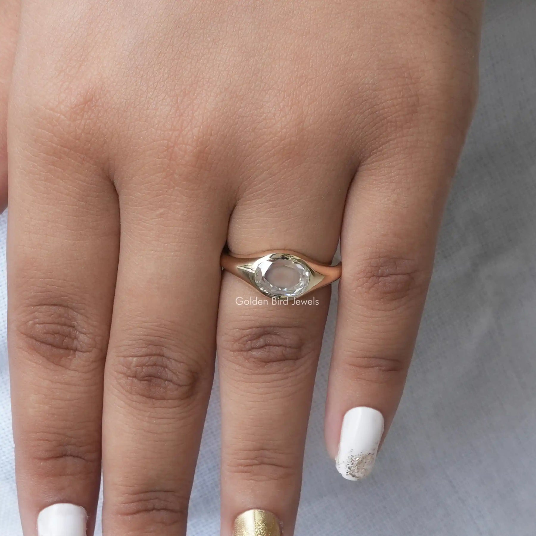 Detailed View Of Moissanite Rose Cut Oval Bezel Set Ring In Yellow Gold