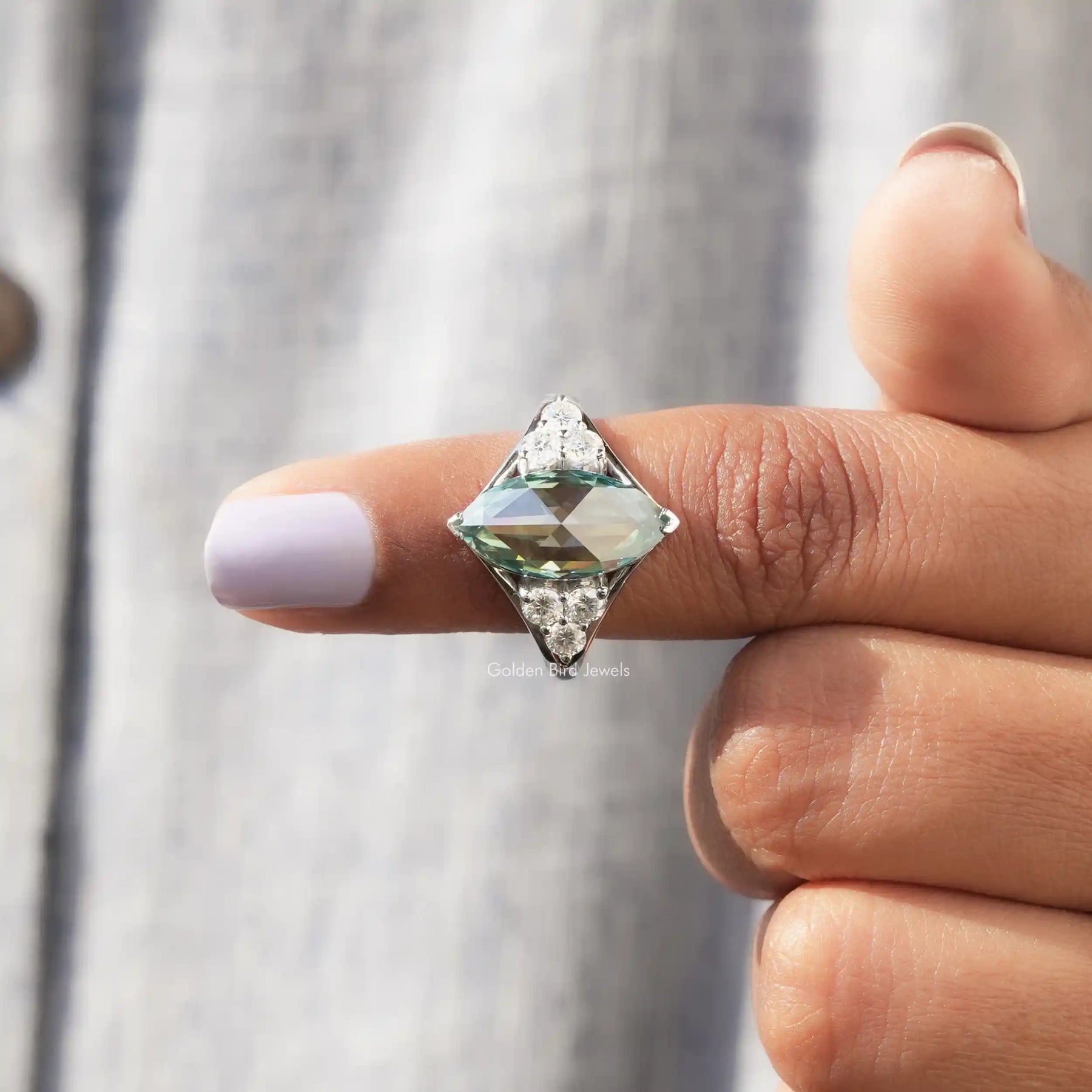 Close-Up View of Rose Cut Moissanite Engagement Ring in a finger