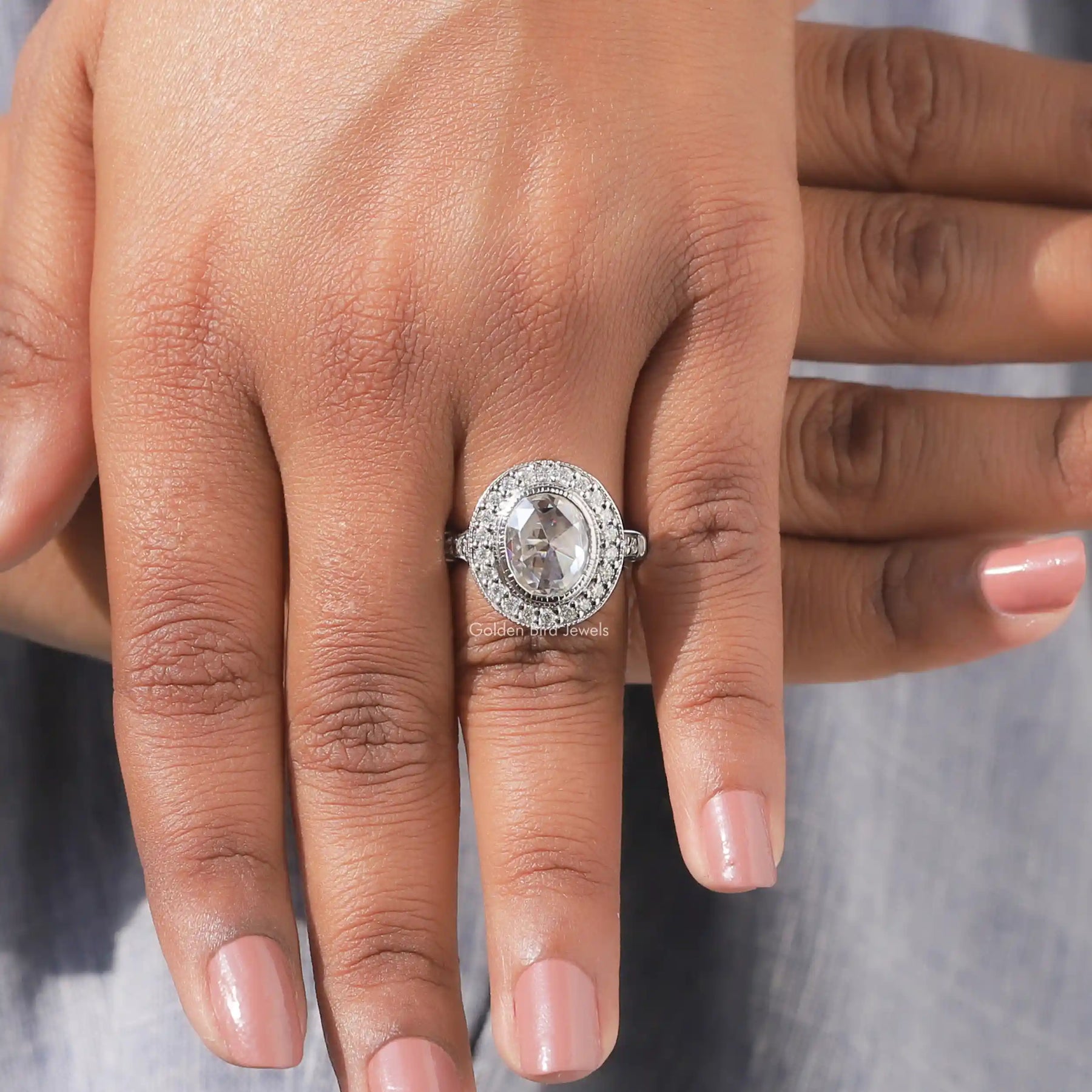 View of Oval Cut Moissanite Halo Engagement Ring In finger