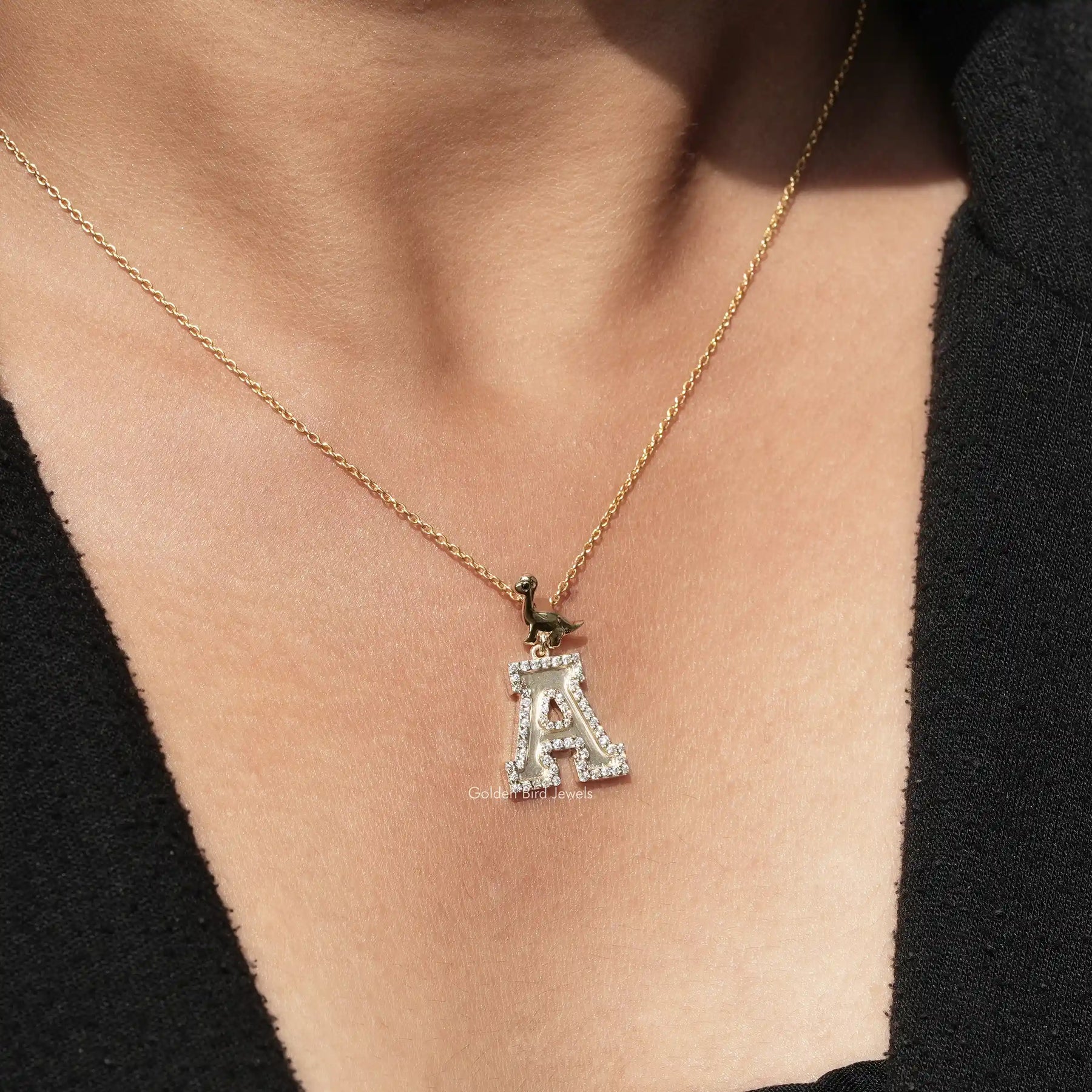 In front view of moissanite round cut pendant in A letter
