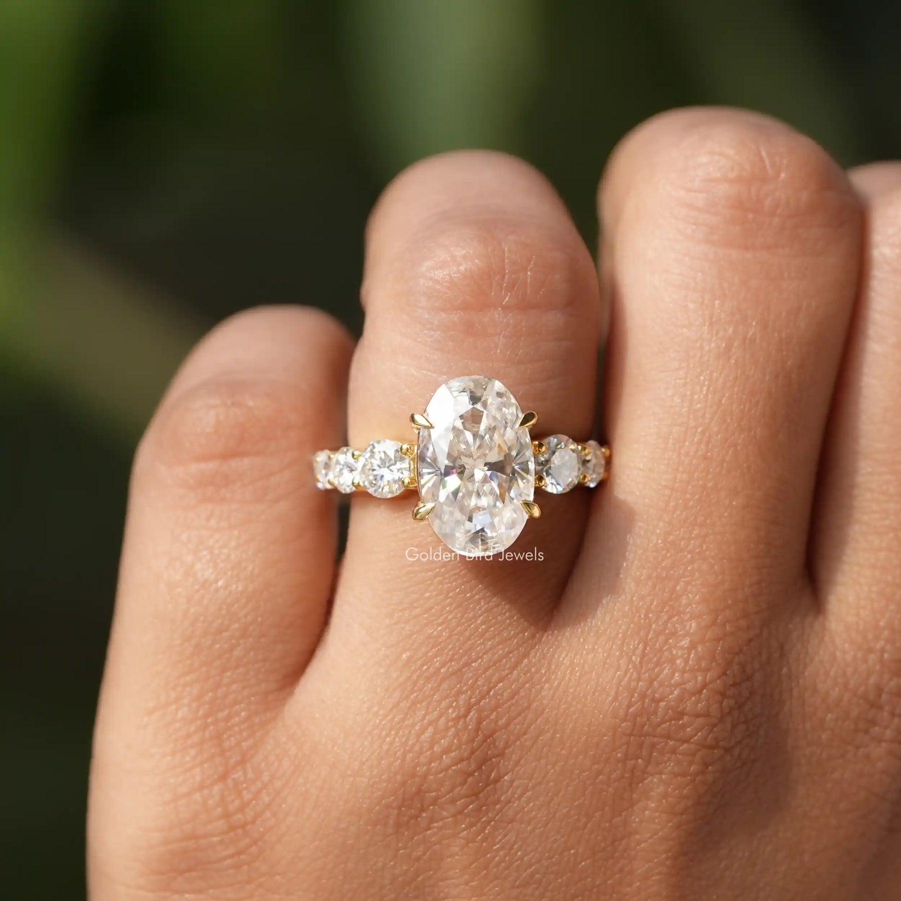 Close-Up View of Oval Cut Solitaire Accent Stone Ring In Yellow Gold
