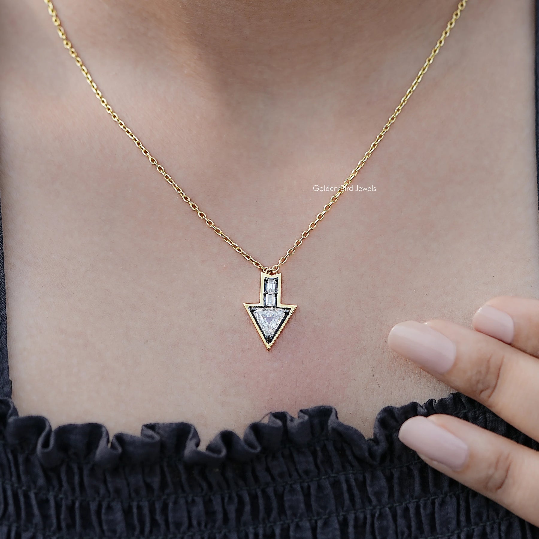 Side View Of Triangle And Baguette Shaped pendant