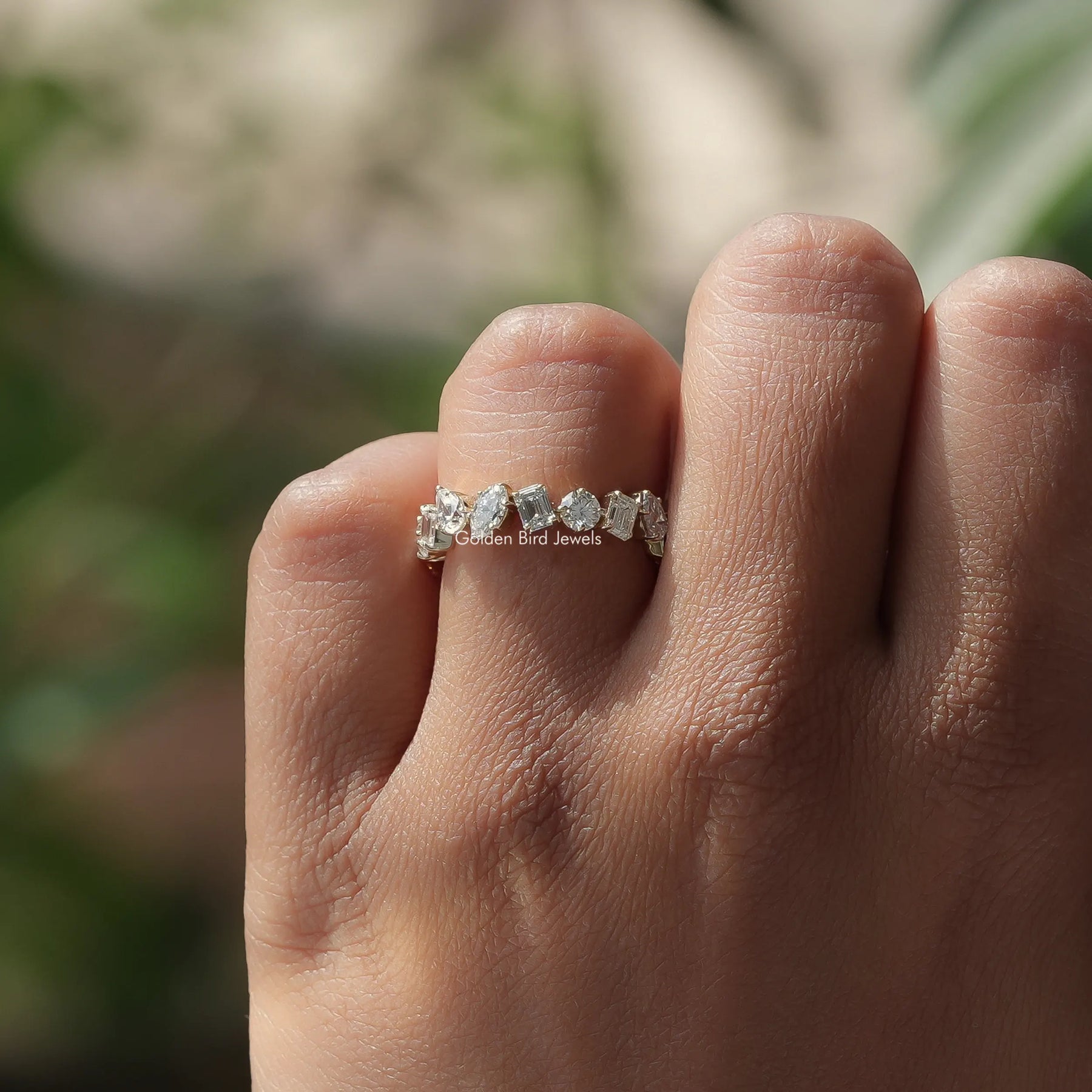 Close-Up View of Marquise And Pear Cut Lab Diamond Eternity Wedding Band In Yellow Gold