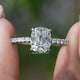 Old Mine Cushion Cut Solitaire Ring Held Between Fingers