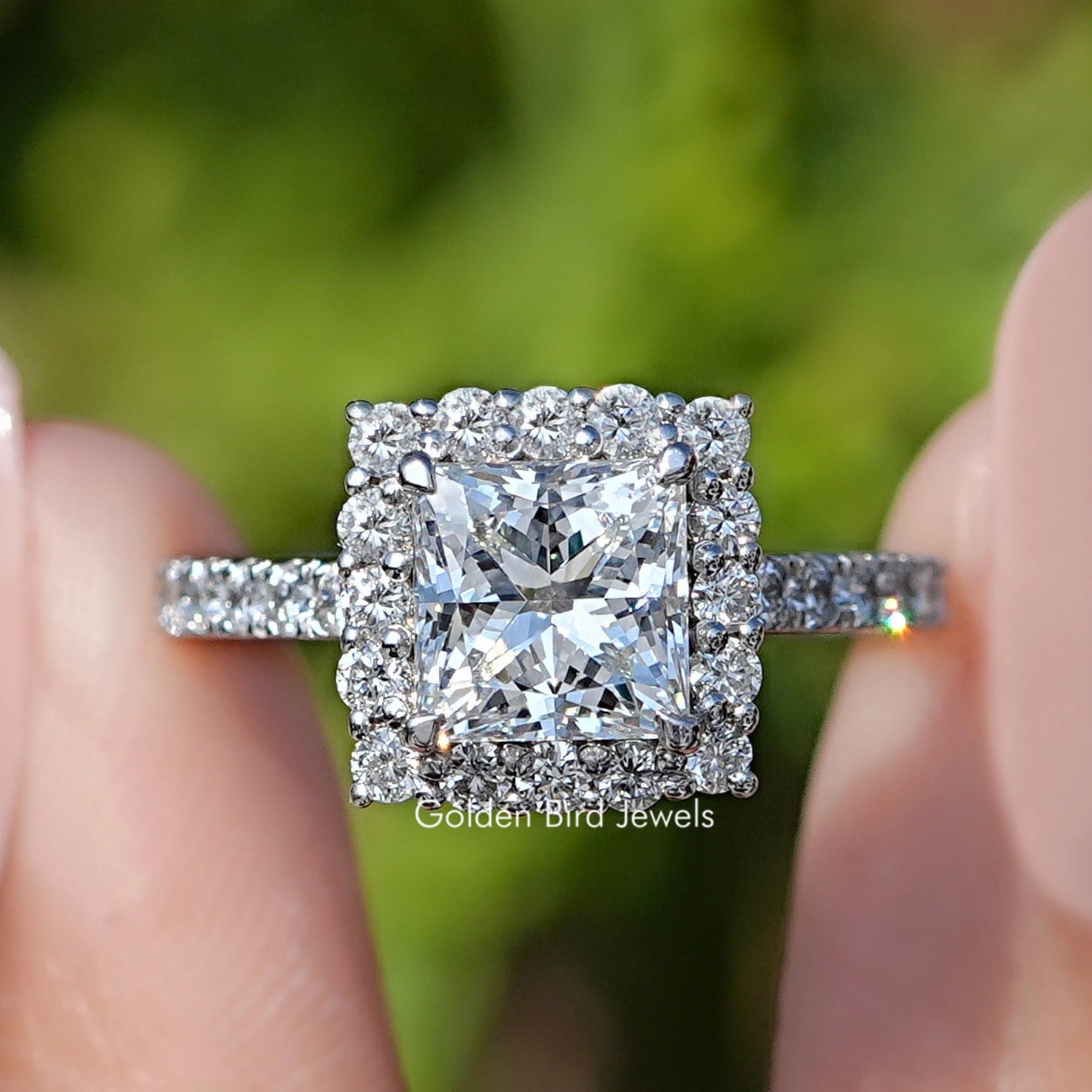 Front view of Princess Cut Lab Diamond Halo Accent Ring in two fingers