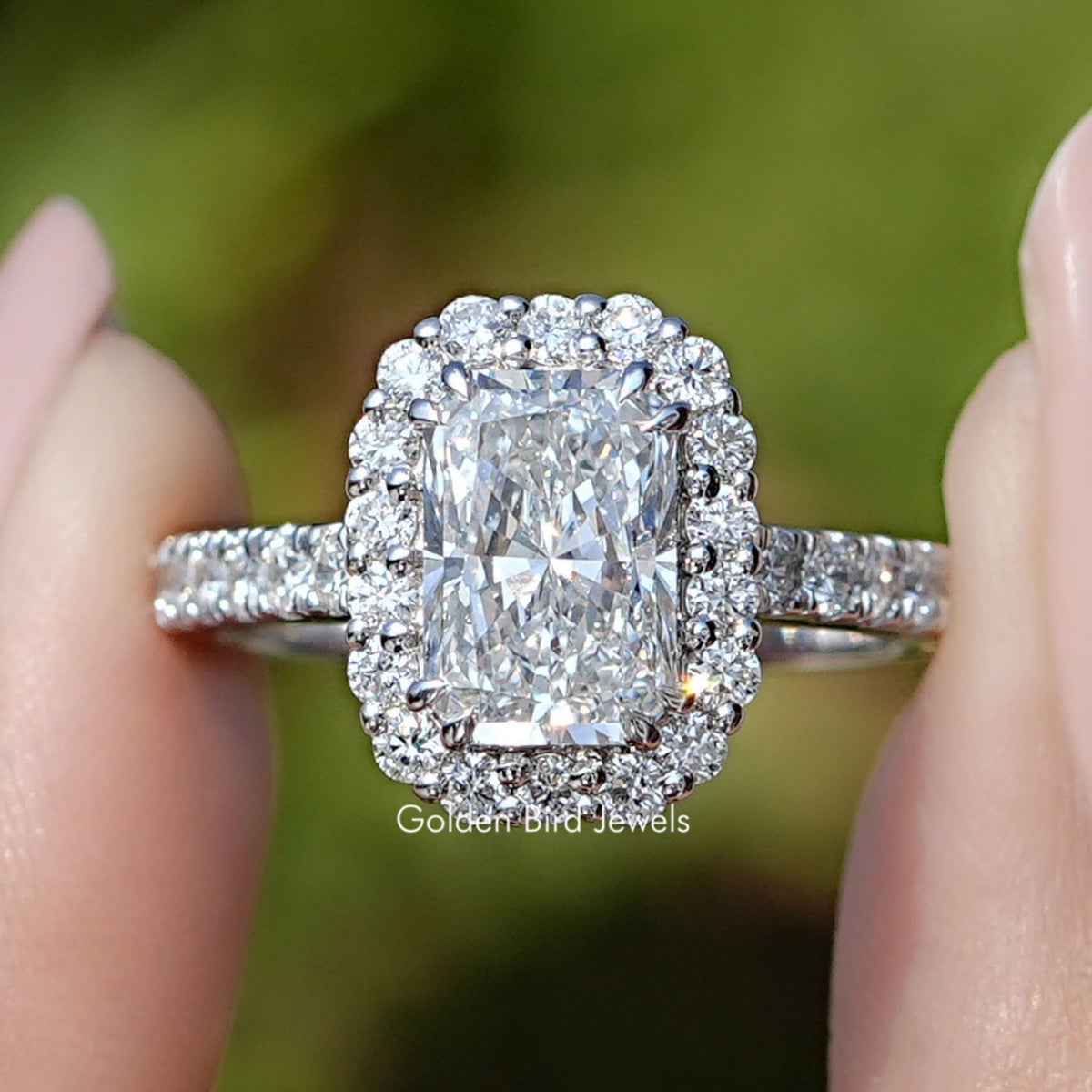 Radiant Lab Diamond Halo Accent Engagement Ring Held Between Fingers