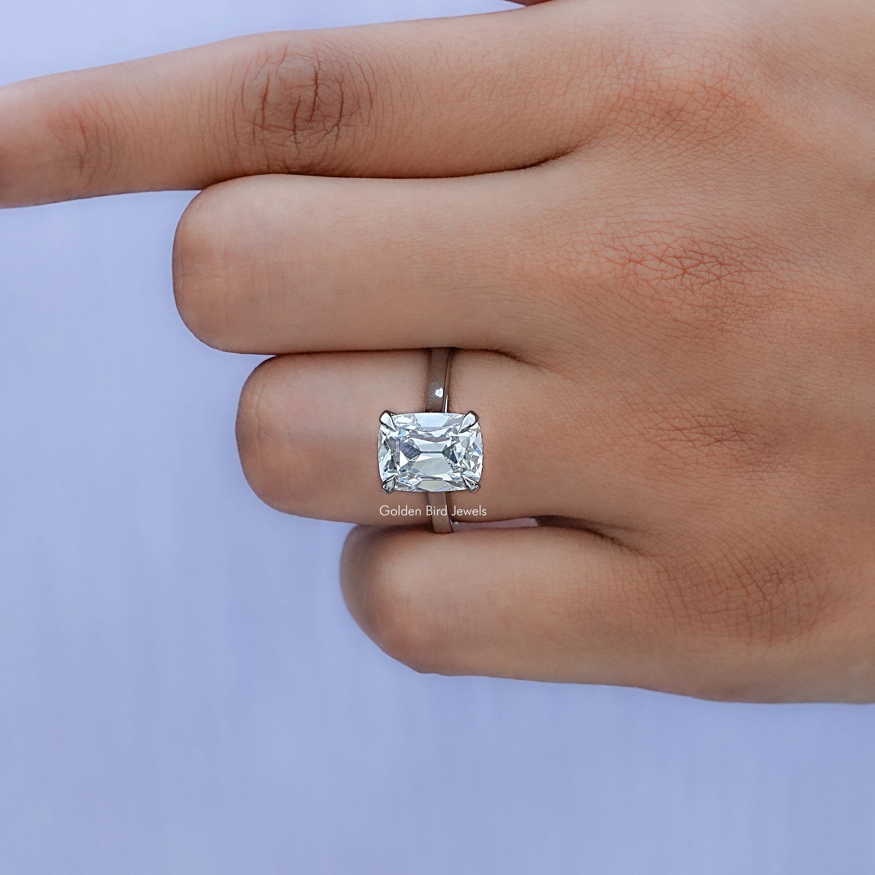 View of OMC Elongated Hidden Halo Lab Diamond Ring In Finger