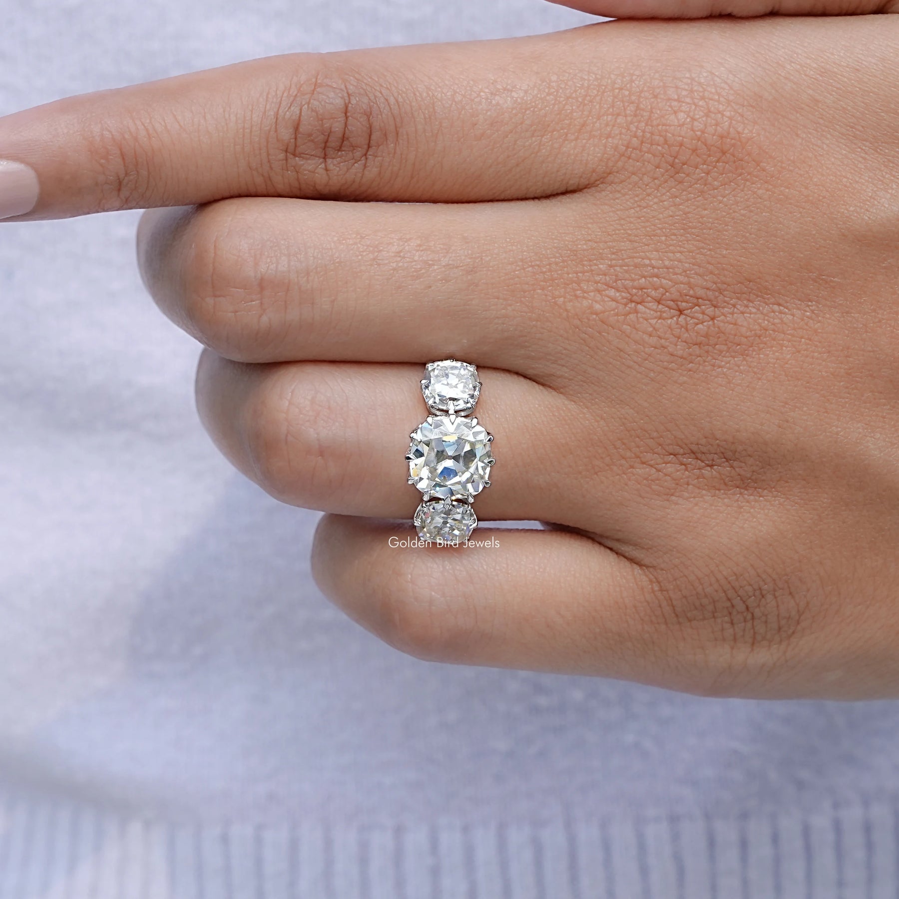 View of Old Mine Cushion Three Stone Moissanite Ring