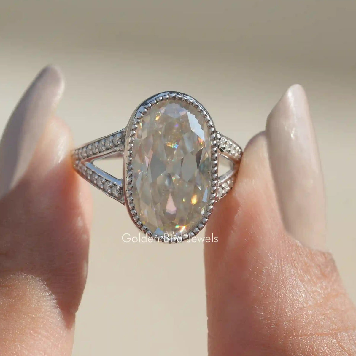 Front View of Old Mine Oval Cut Moissanite Wedding Ring In Two Fingers