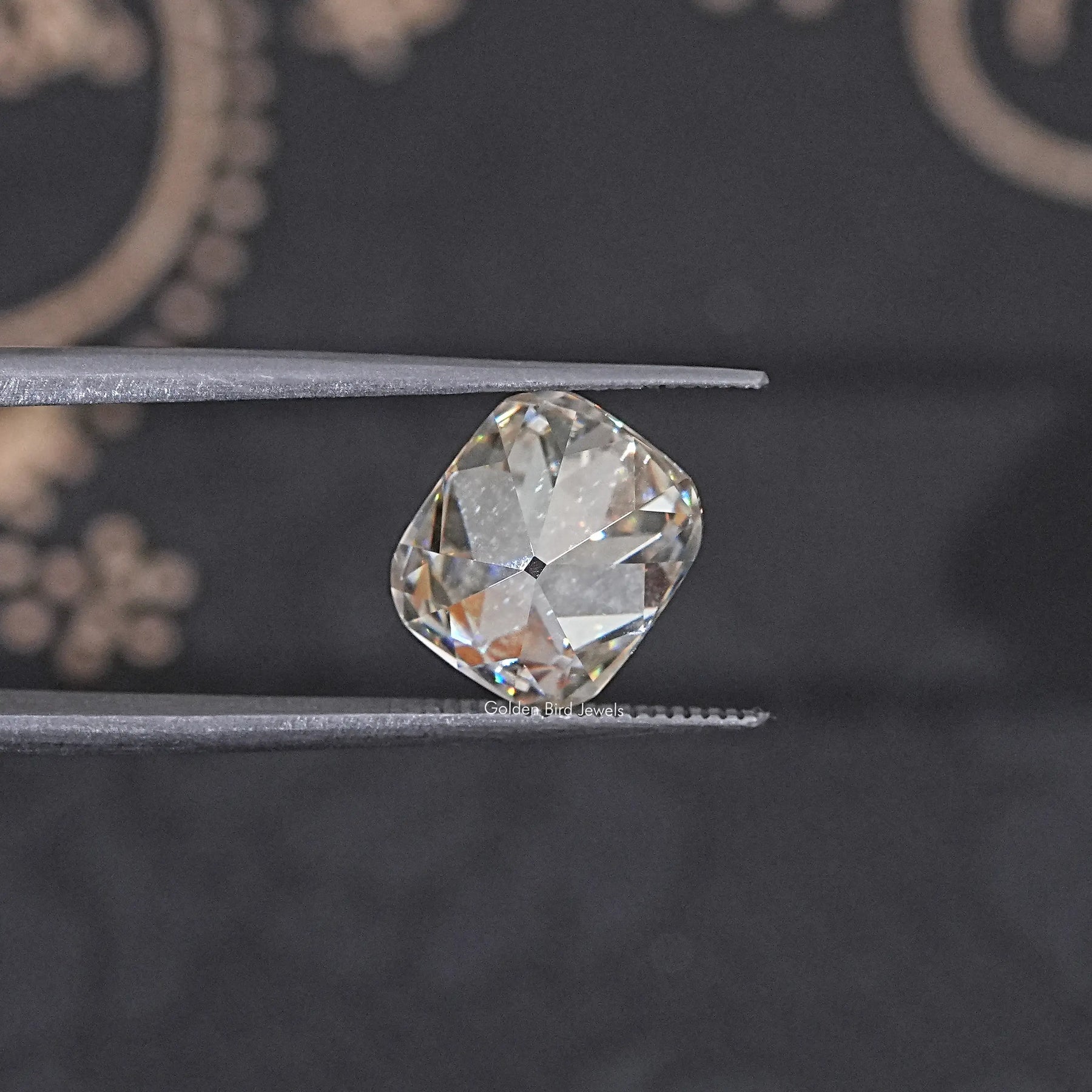 In Tweezer View Of Old Mine Cushion Cut Loose Moissanite Stone
