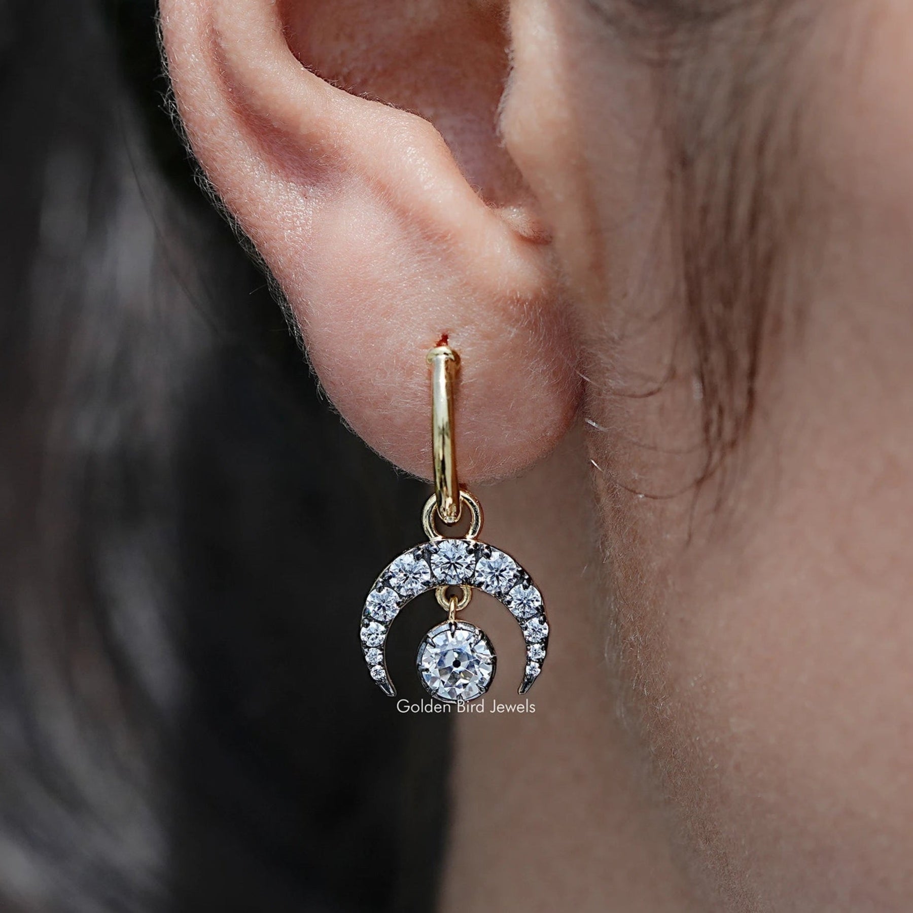 In Ear View Of Old European Round Moissanite Dangle Hoop Earrings in prongs setting